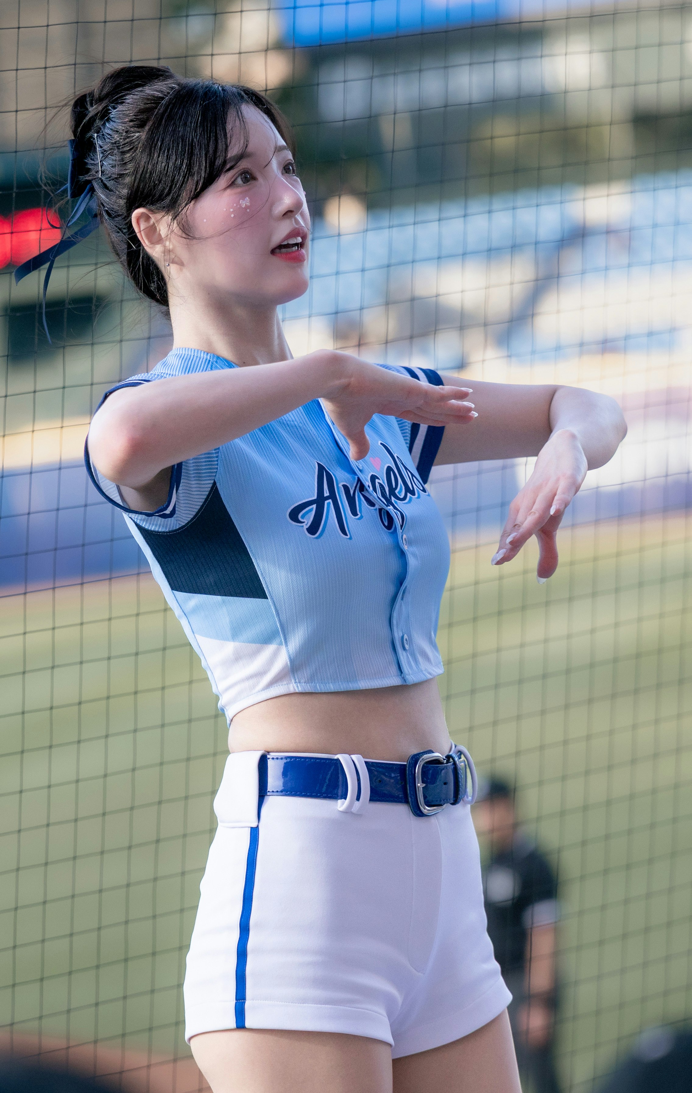 female athlete posing on an outdoor sports field