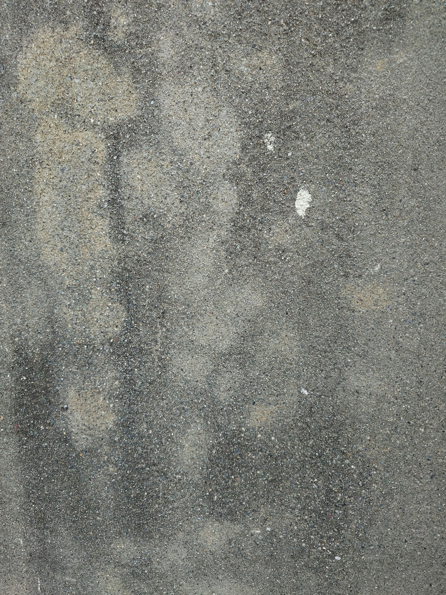 Surface grise avec des motifs et textures irréguliers visibles