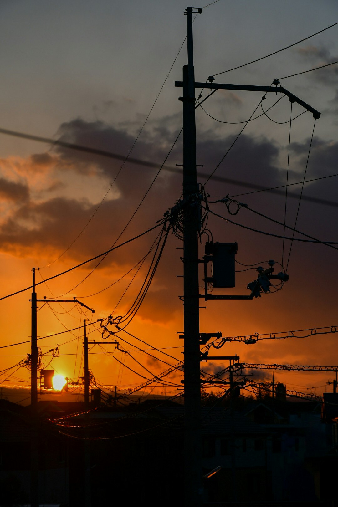 winter sunset sky with power lines and utility poles