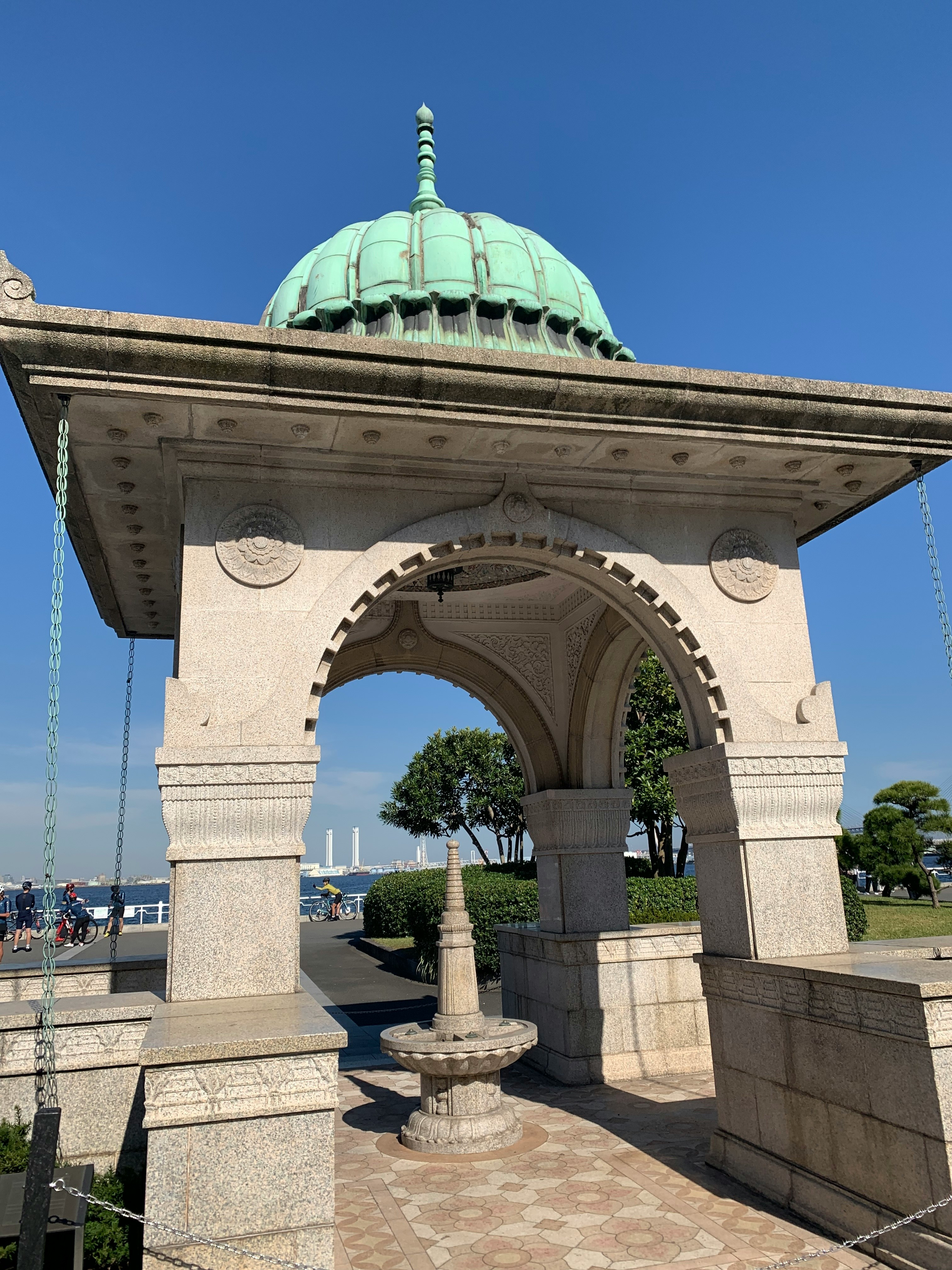 stone archway and domed roof entrance under a blue sky