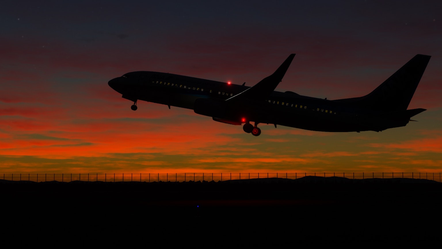 Silhouette di un aereo in decollo contro un cielo al tramonto