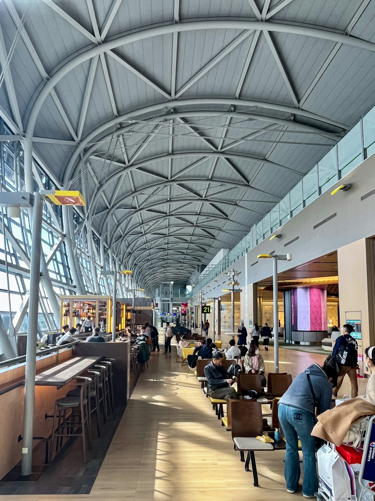 Bright interior of an airport lounge showing architectural structure