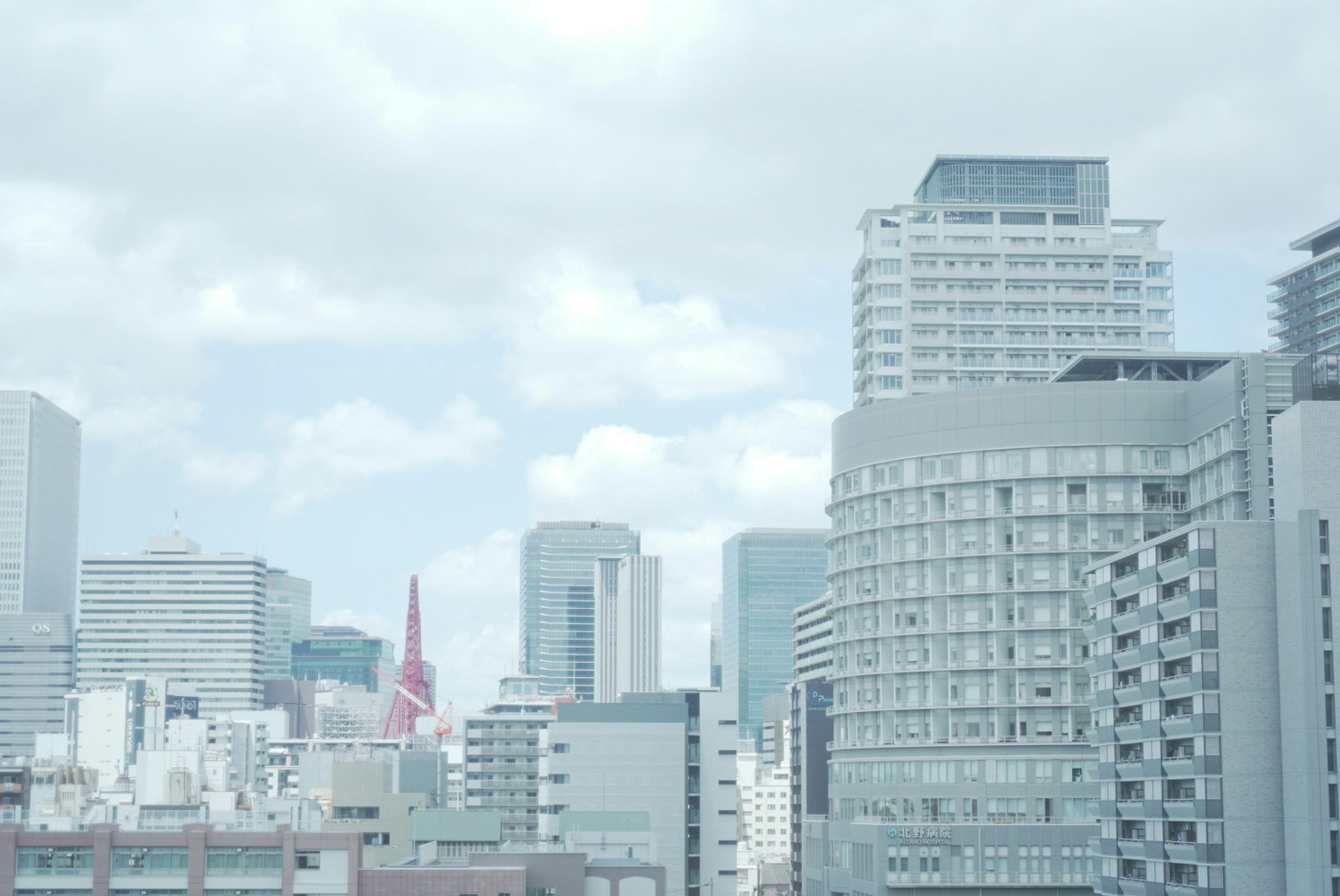 Modern skyscrapers of Tokyo under a cloudy sky