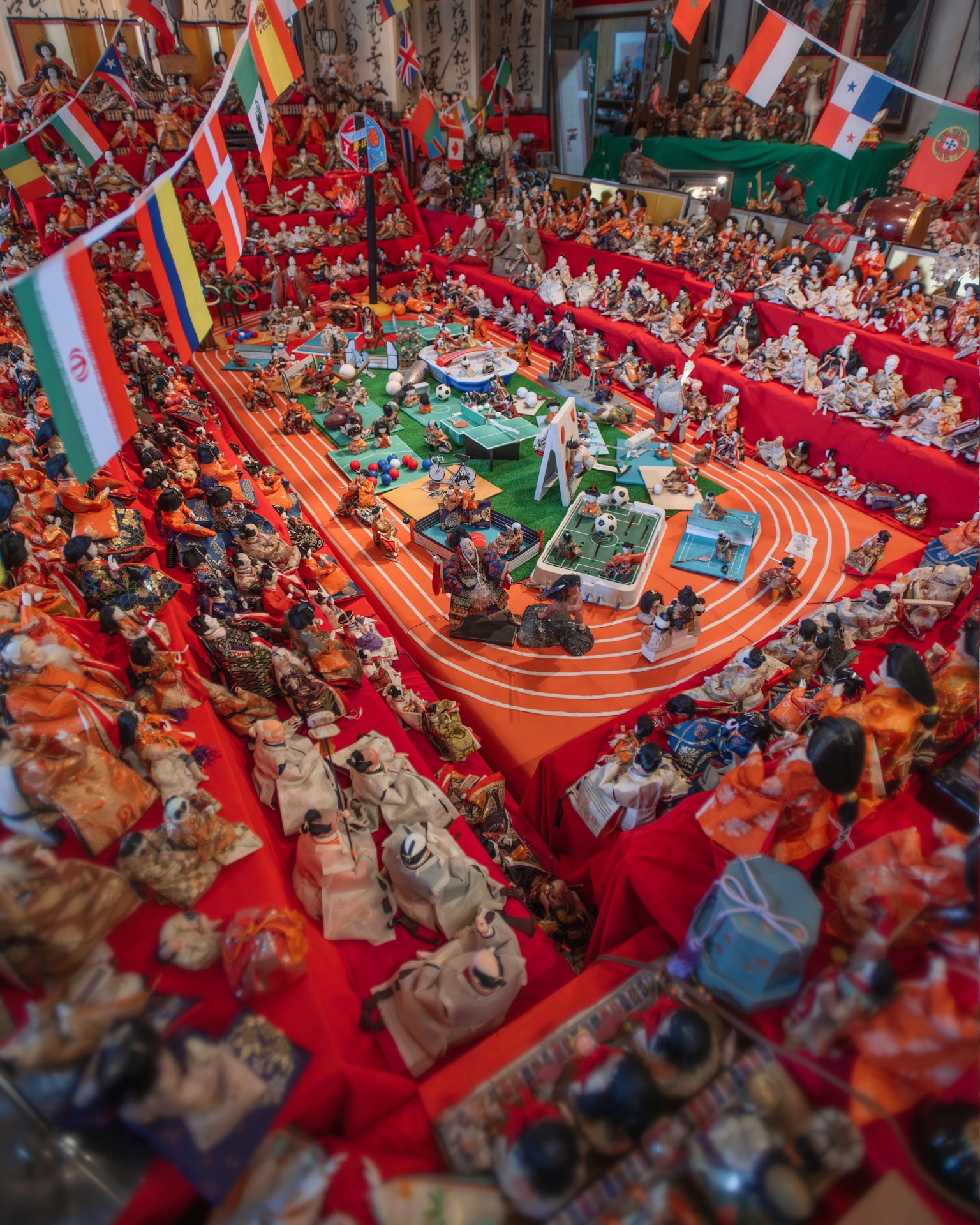 A vibrant festival scene with colorful flags and numerous dolls and decorations displayed