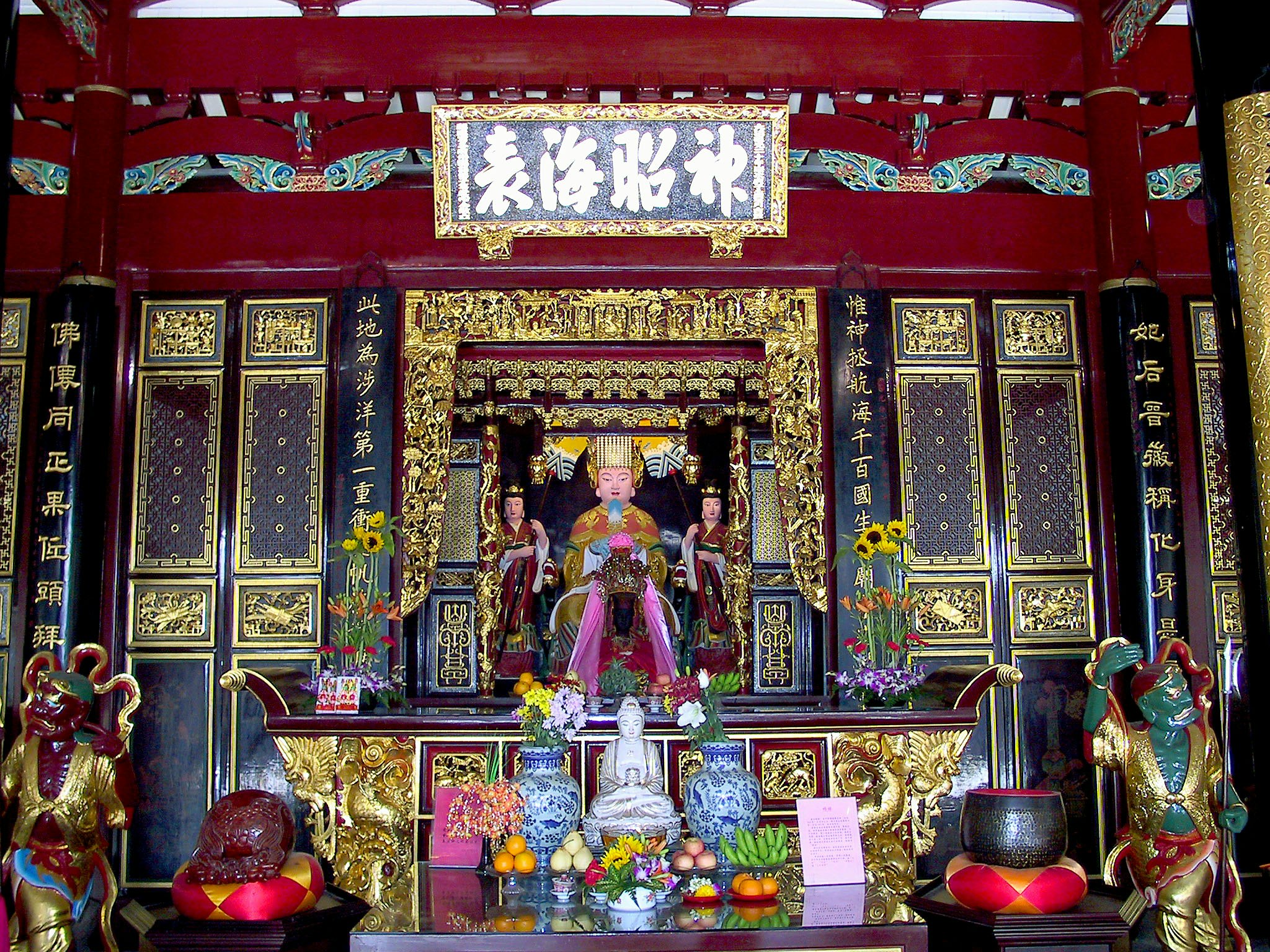 Colorful temple altar with statues and offerings