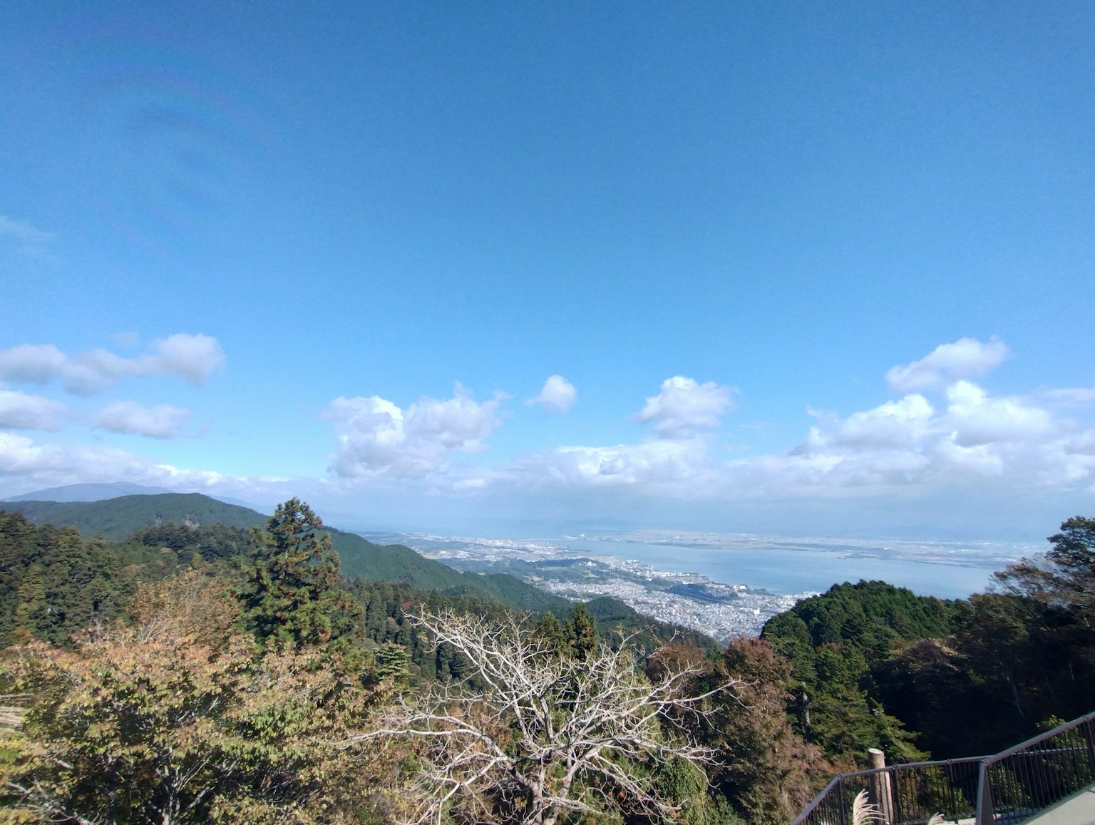 Mountain view with blue sky clouds and cityscape