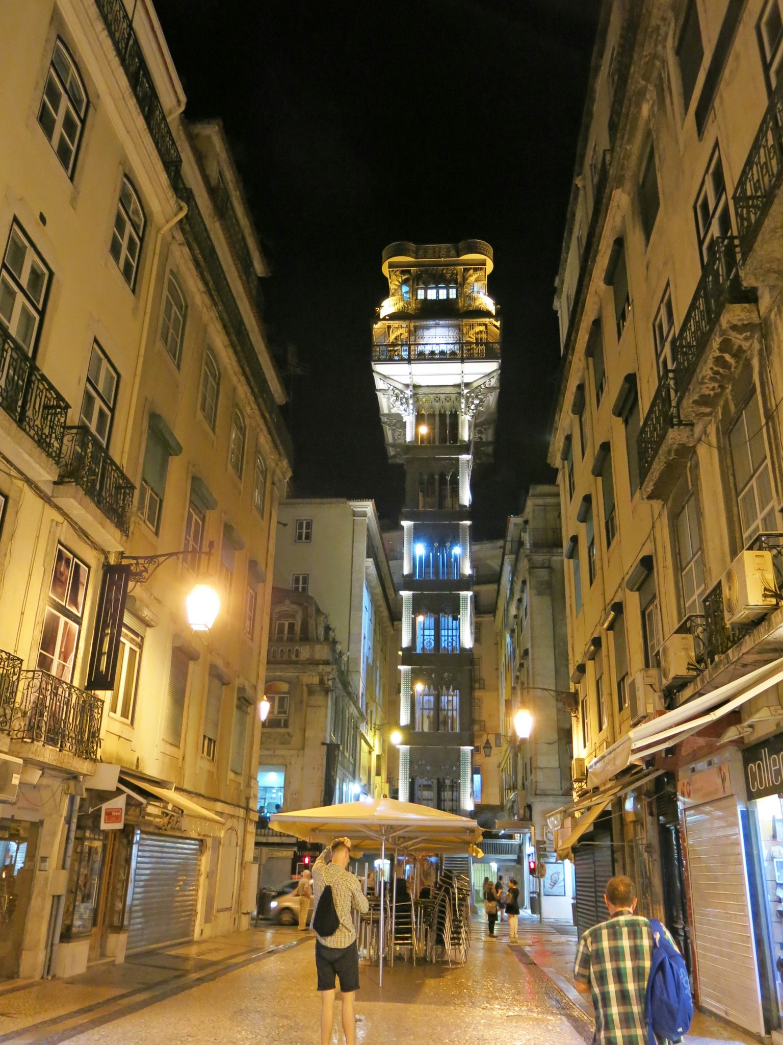 Elevator illuminated at night in the streets of Lisbon