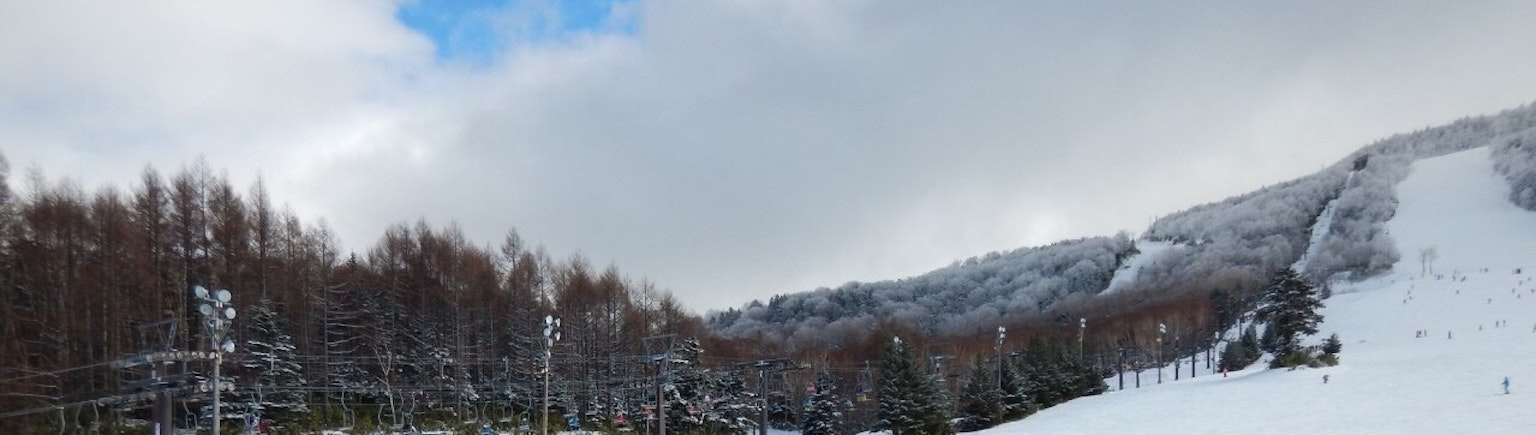 Snow-covered mountain landscape with a blue sky