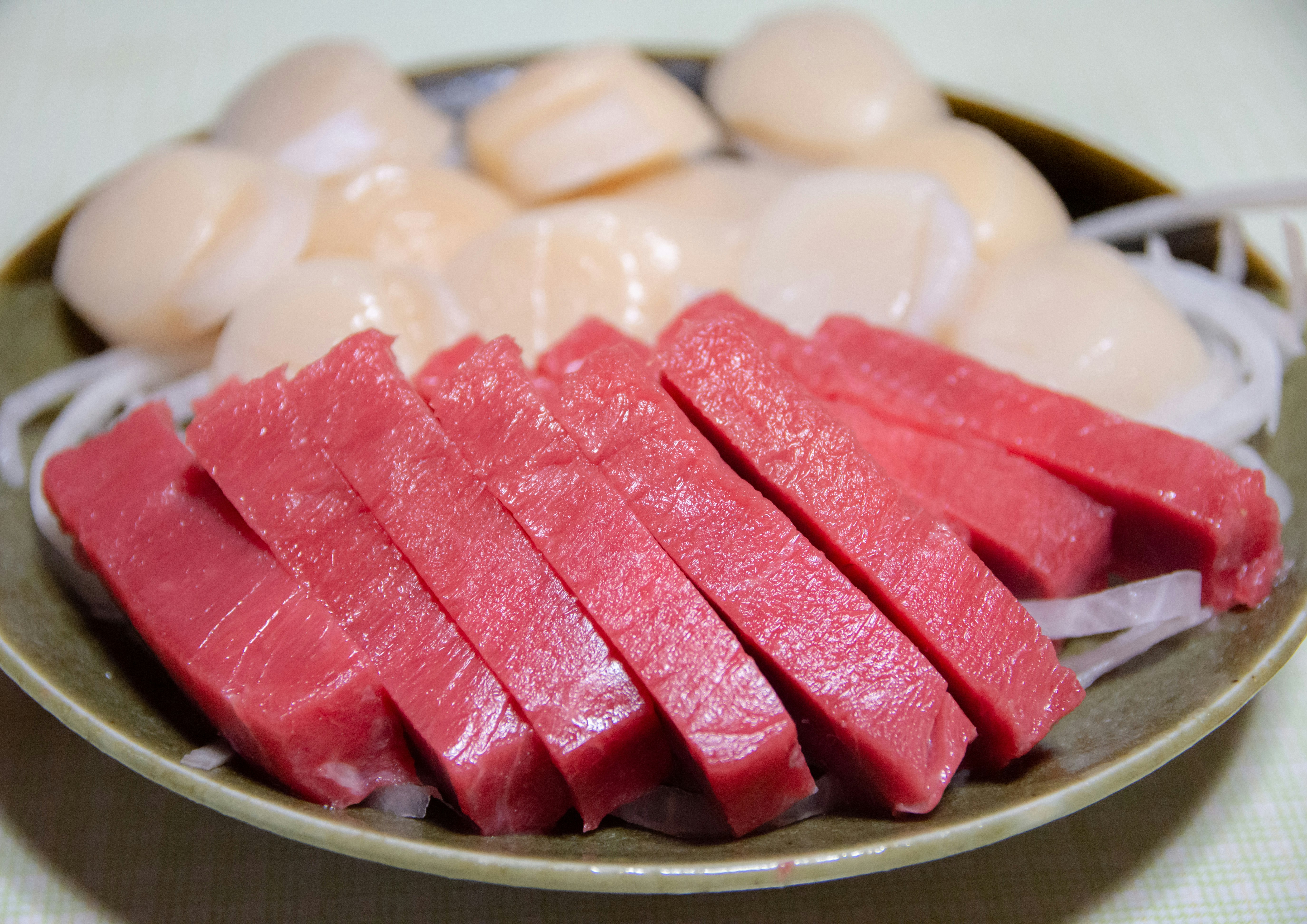 sliced tuna sashimi on a plate
