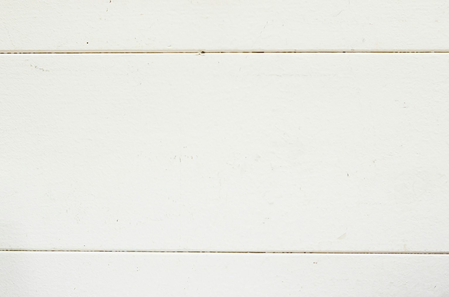 Textured white wooden planks arranged horizontally