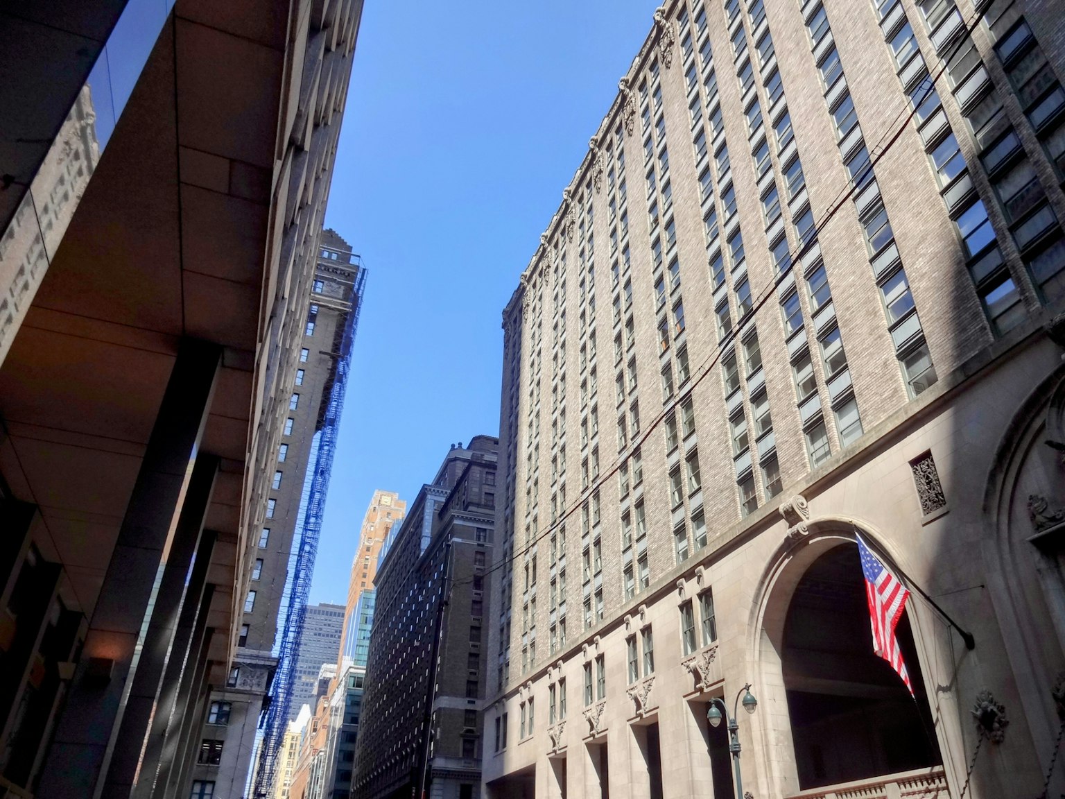 Urban scene with tall buildings and clear blue sky