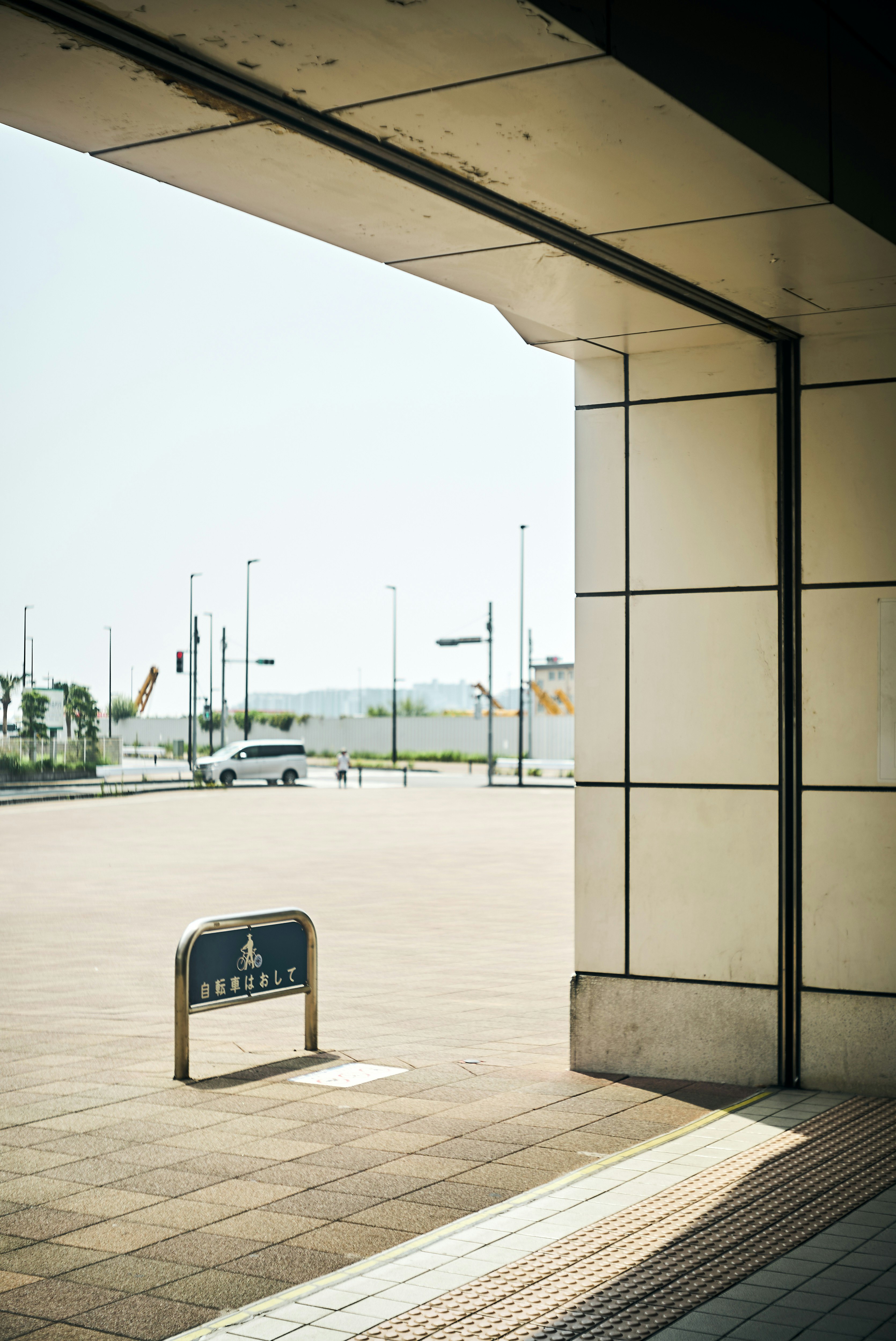 bus stop sign and wide station forecourt scene