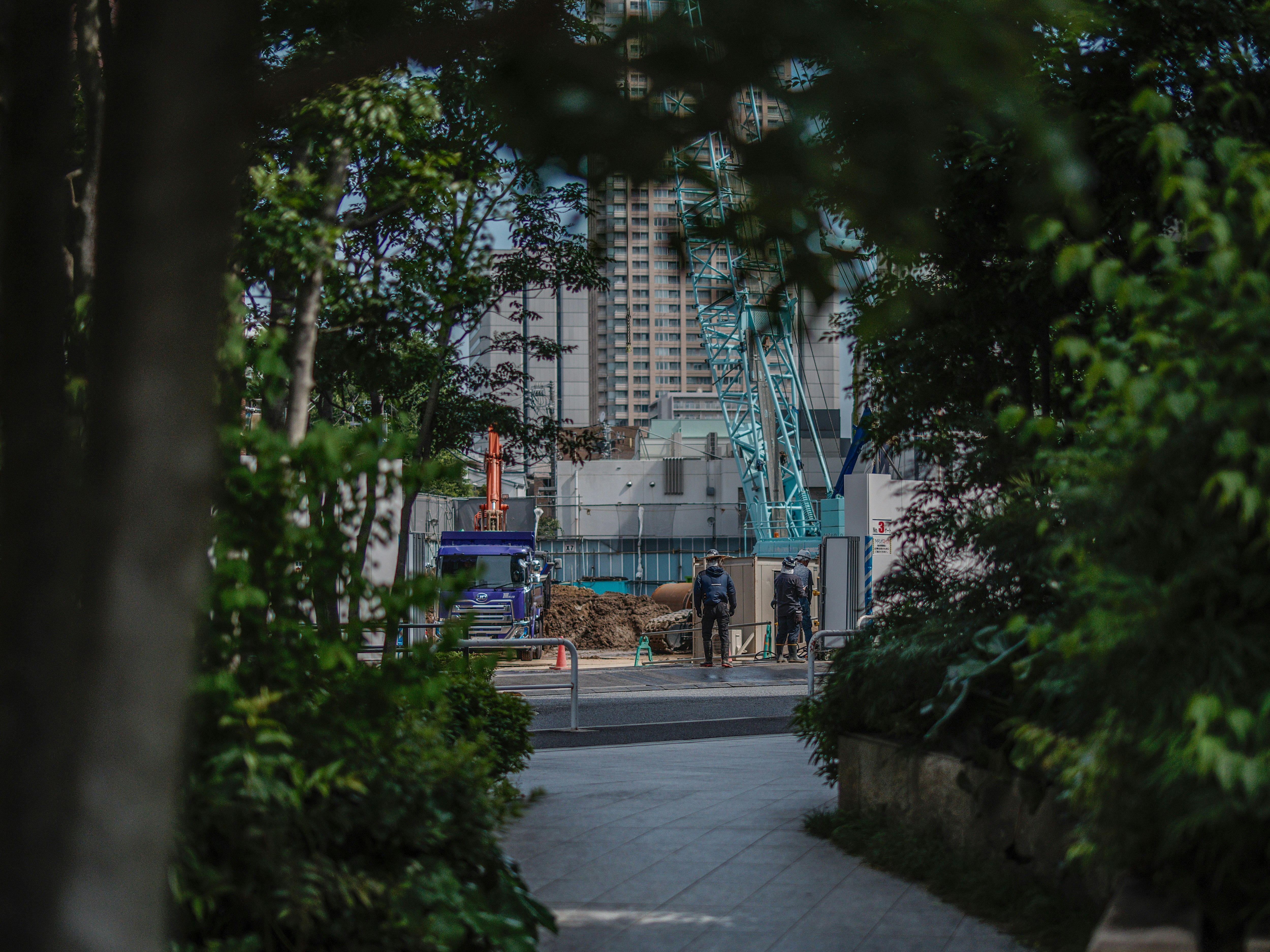 urban streetscape under construction with tall buildings