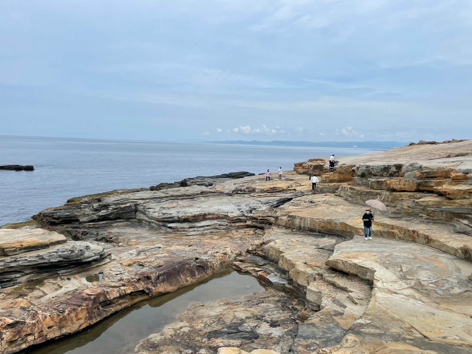 Coastal rock formations with a calm sea