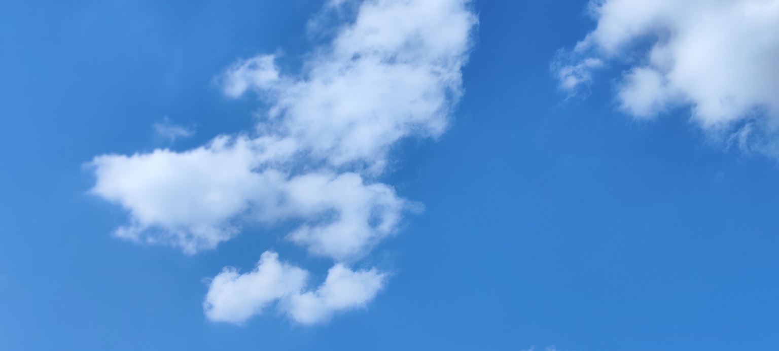 White clouds floating in a blue sky