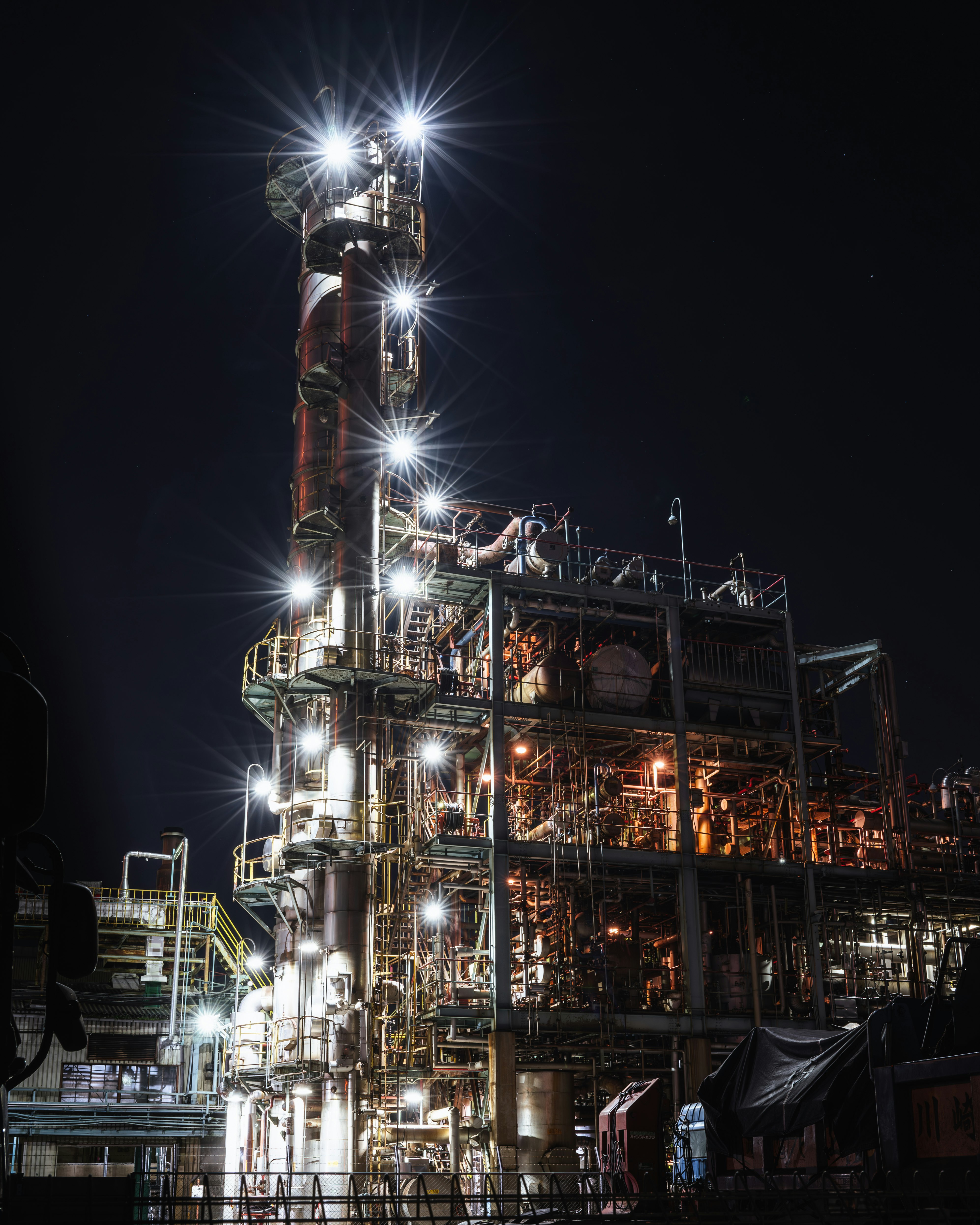 night-lit industrial plant equipment