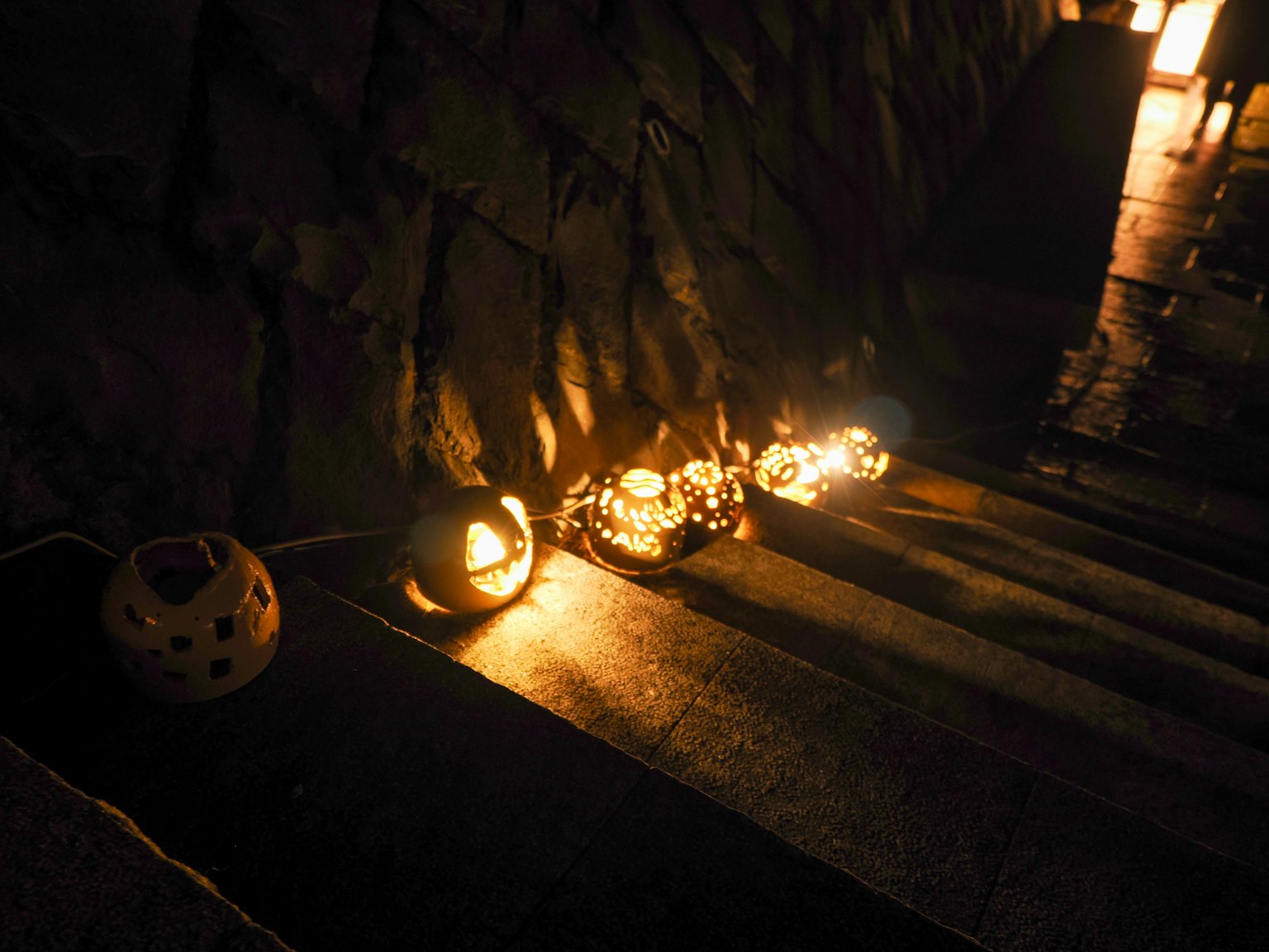 Lanterns lined along the steps creating a warm glow