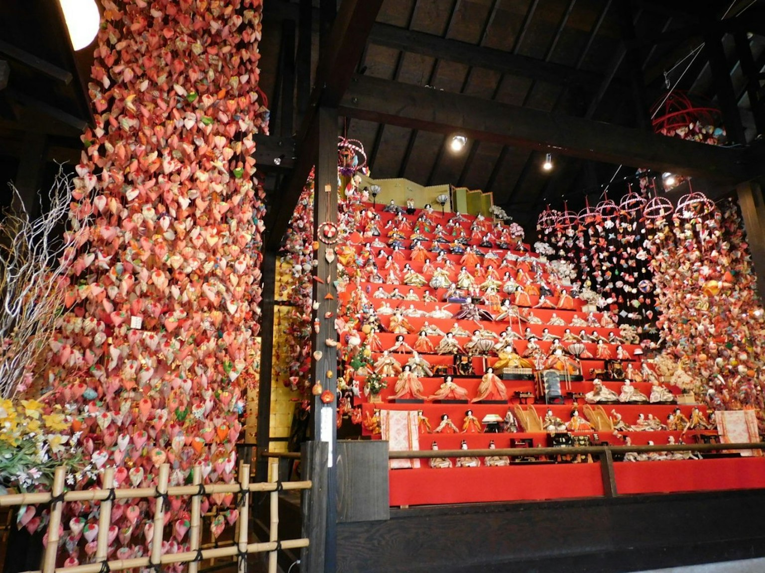 Traditional Japanese festival display featuring red decorations and dolls