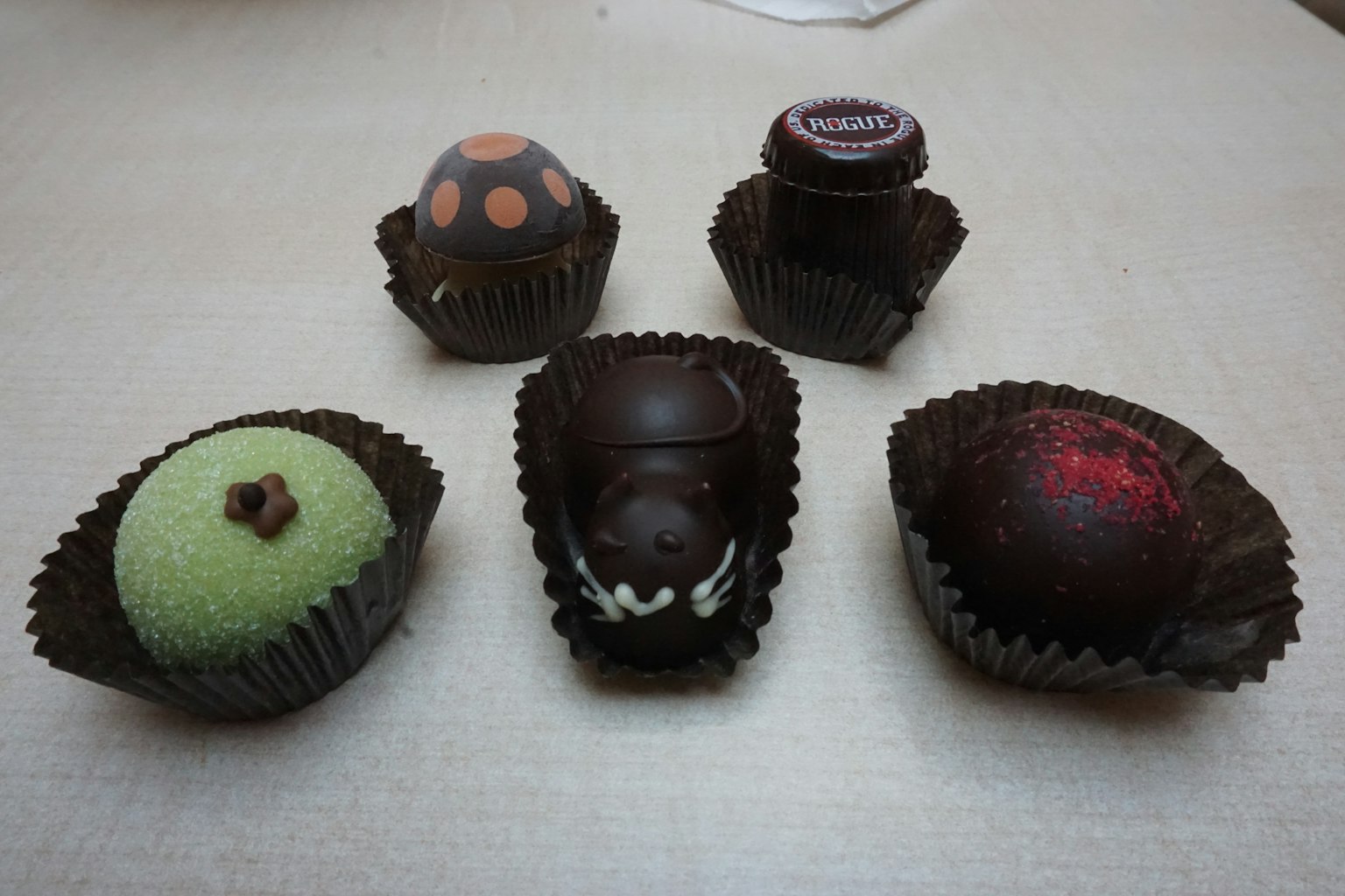 Colorful chocolate confections arranged on a surface