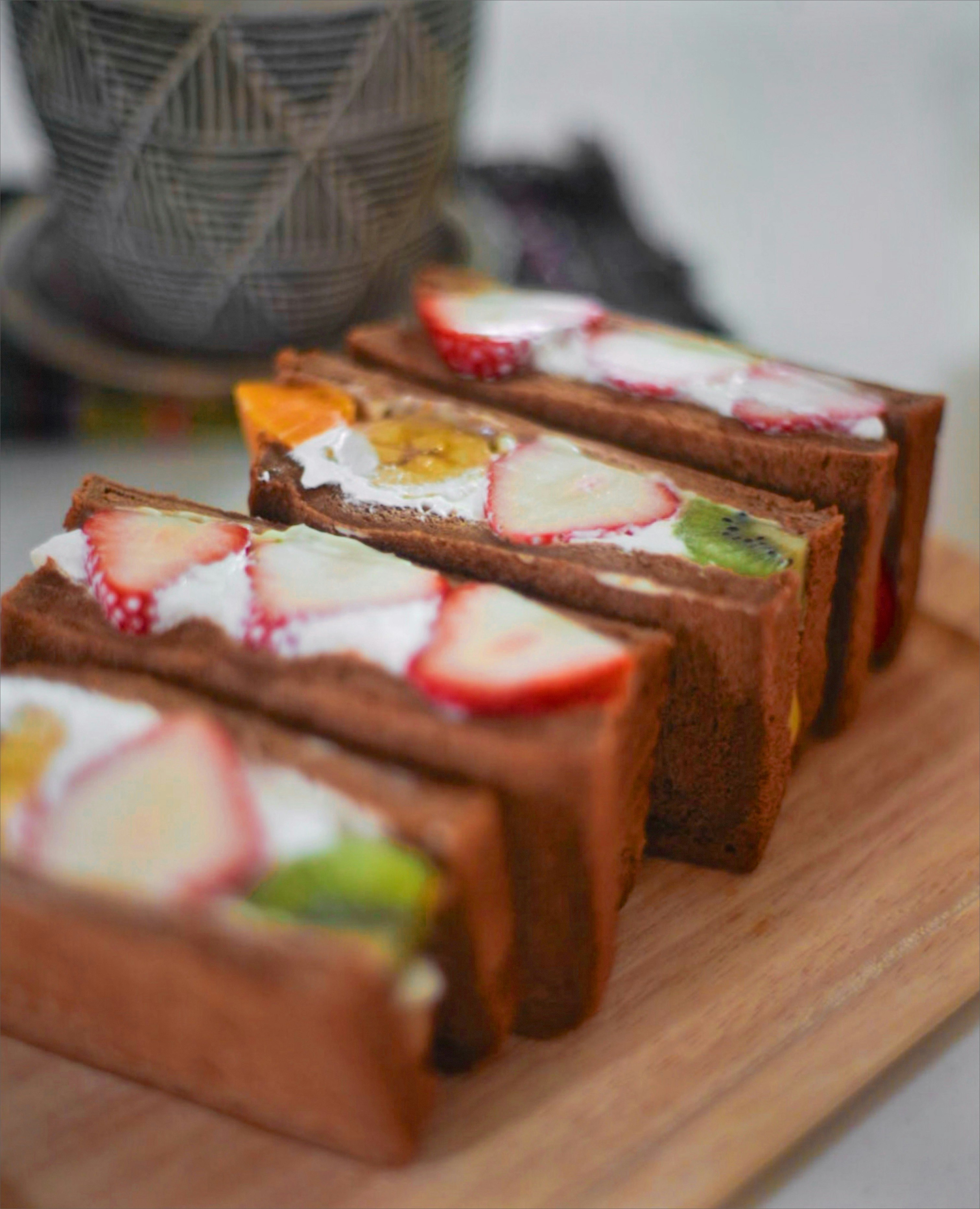 strawberry fruit sandwiches on a wooden tray, cafe snack