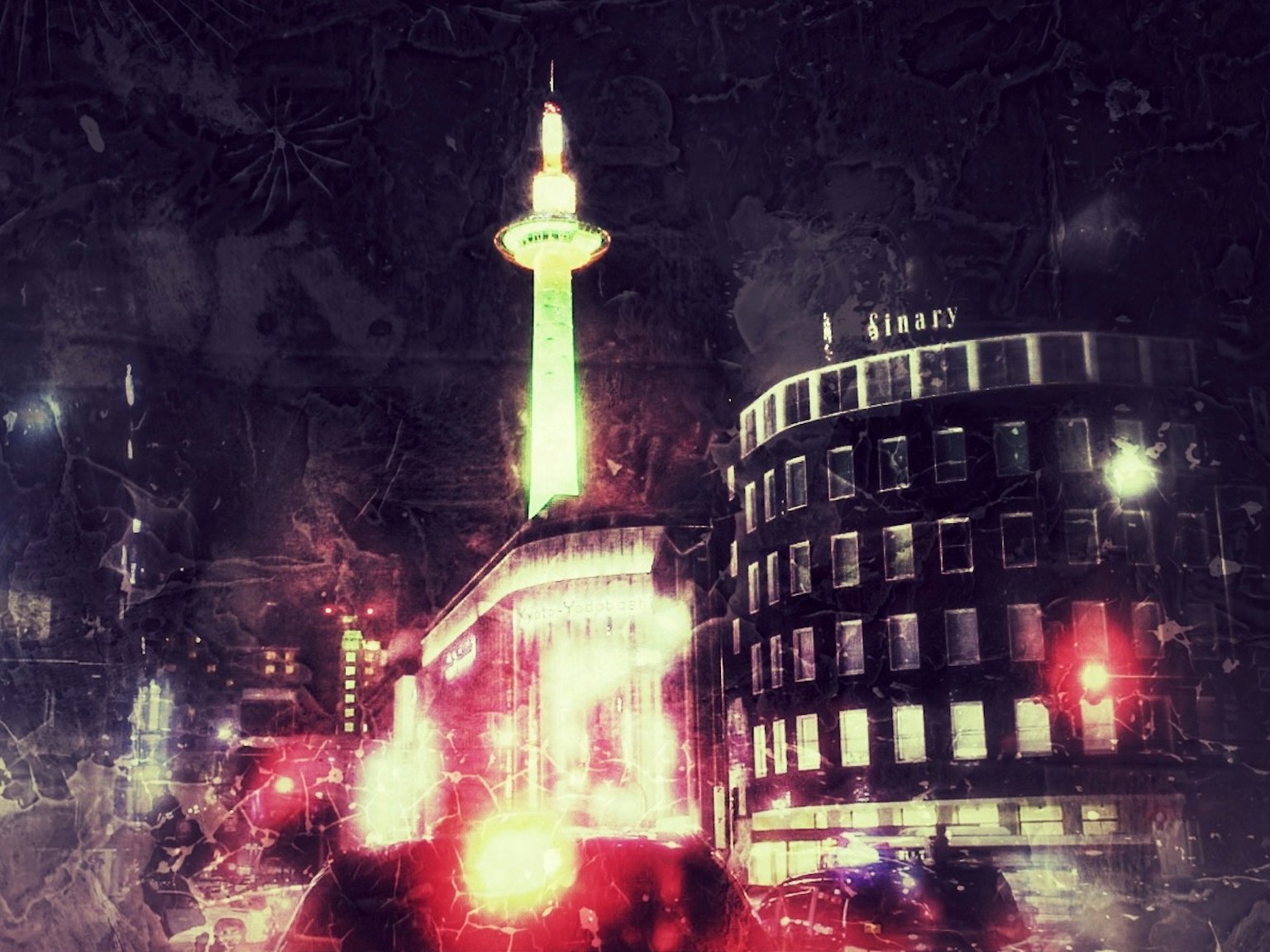 Night cityscape featuring a tall tower and illuminated buildings