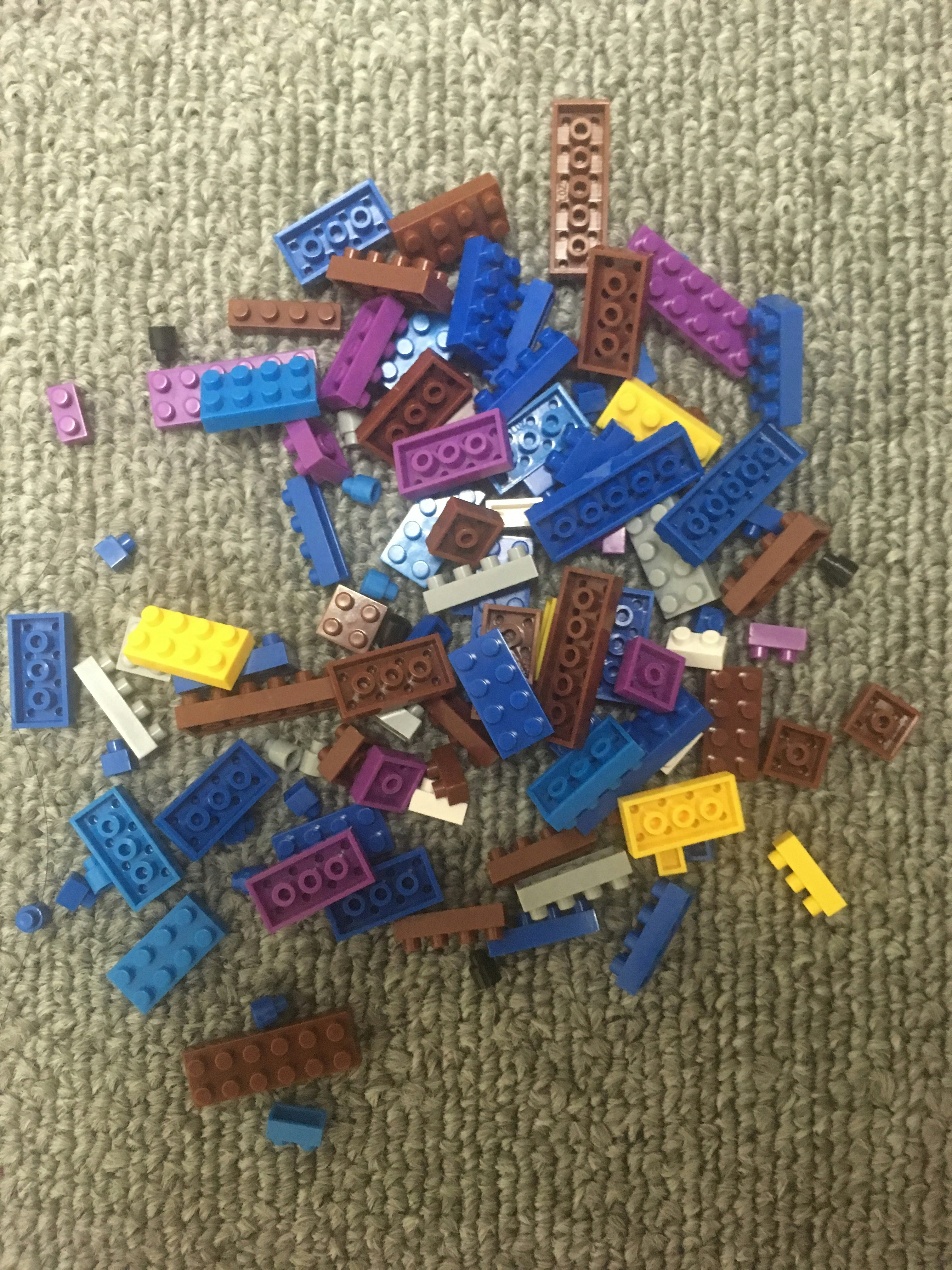 colorful scattered building blocks on a floor