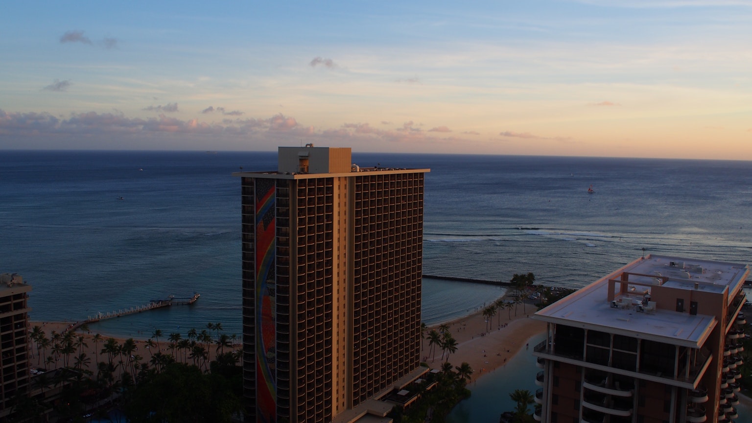 High-rise building with a beautiful sunset over the ocean