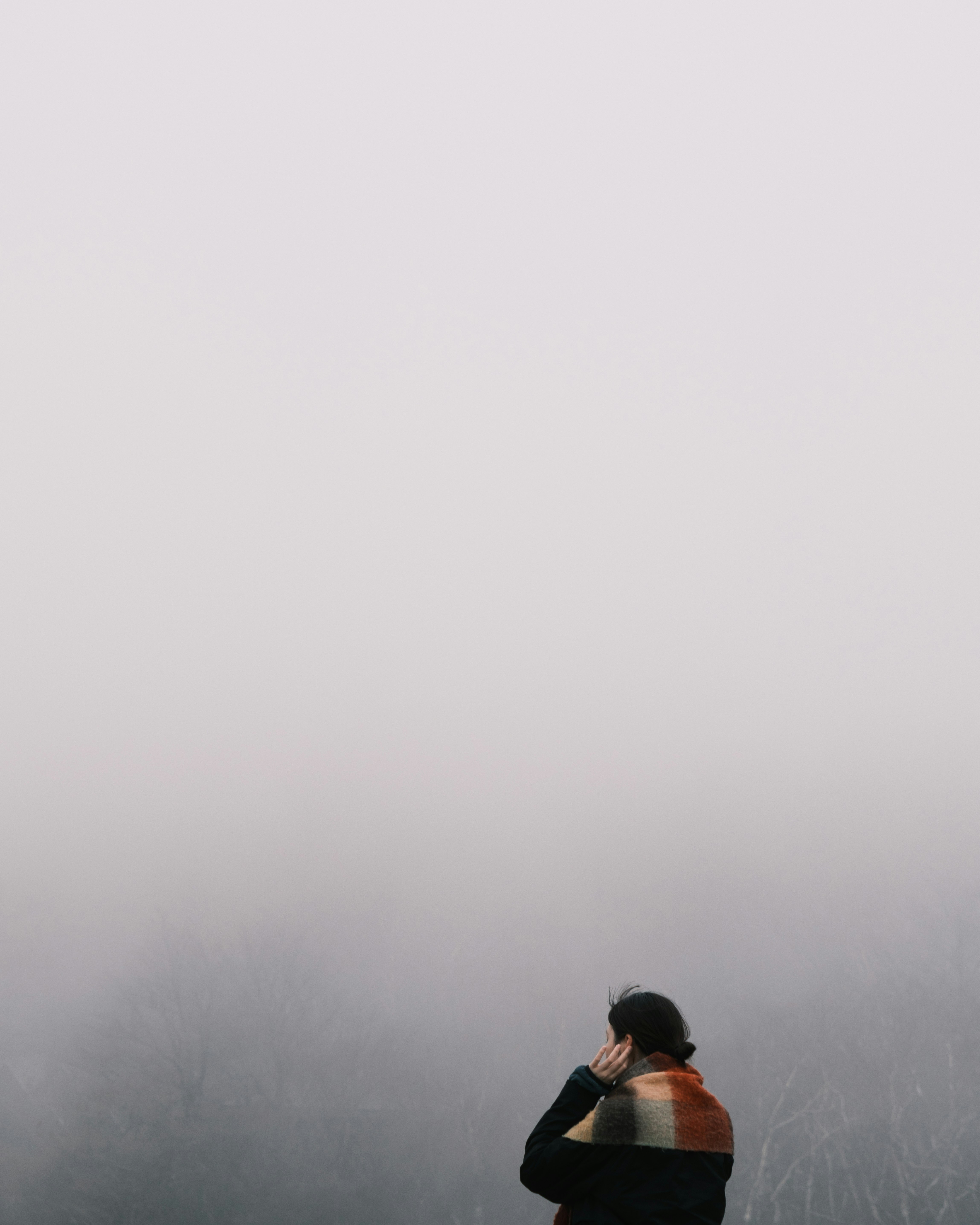 people embracing in the fog