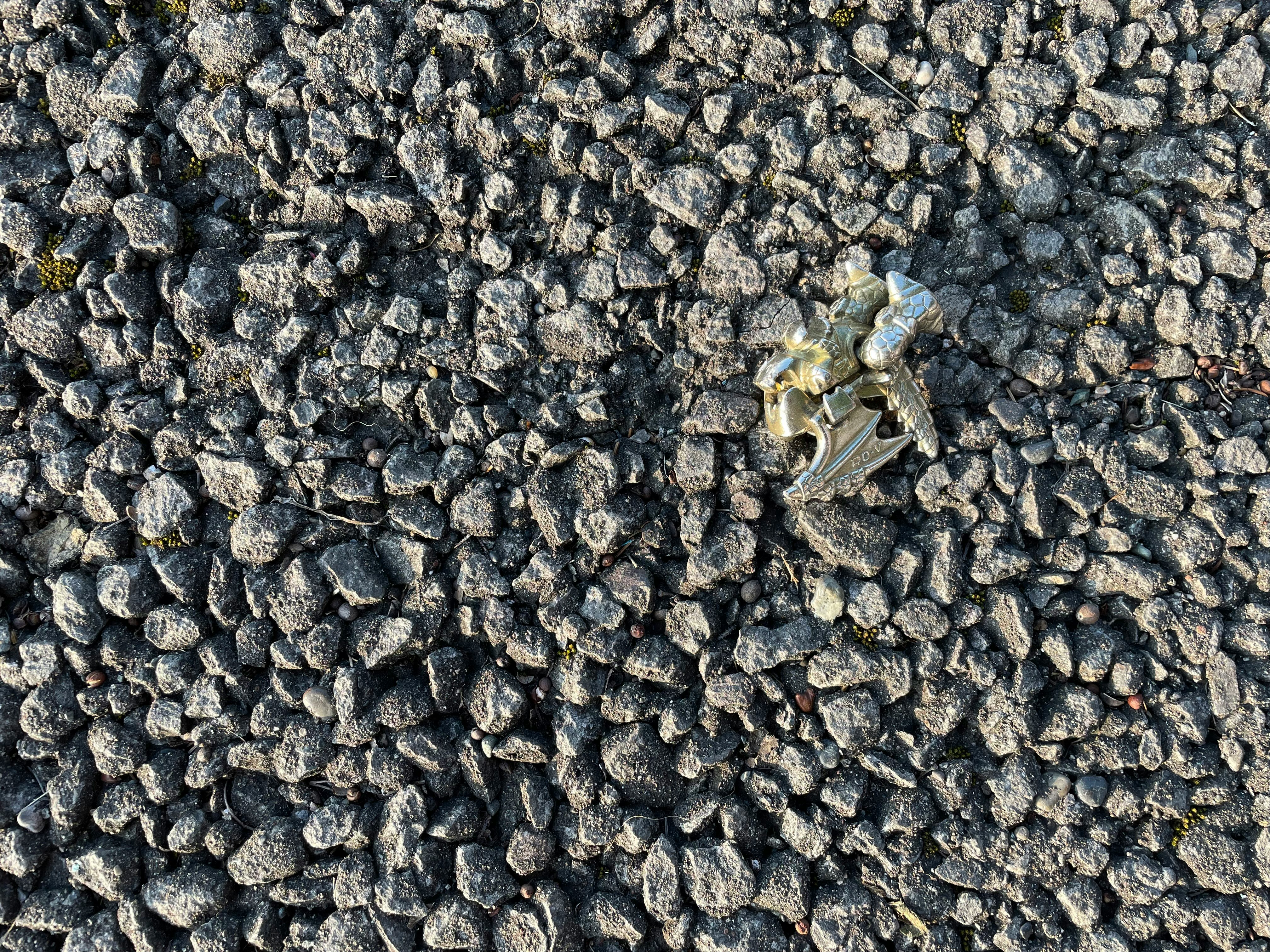 small paper scrap on a stone-paved walkway