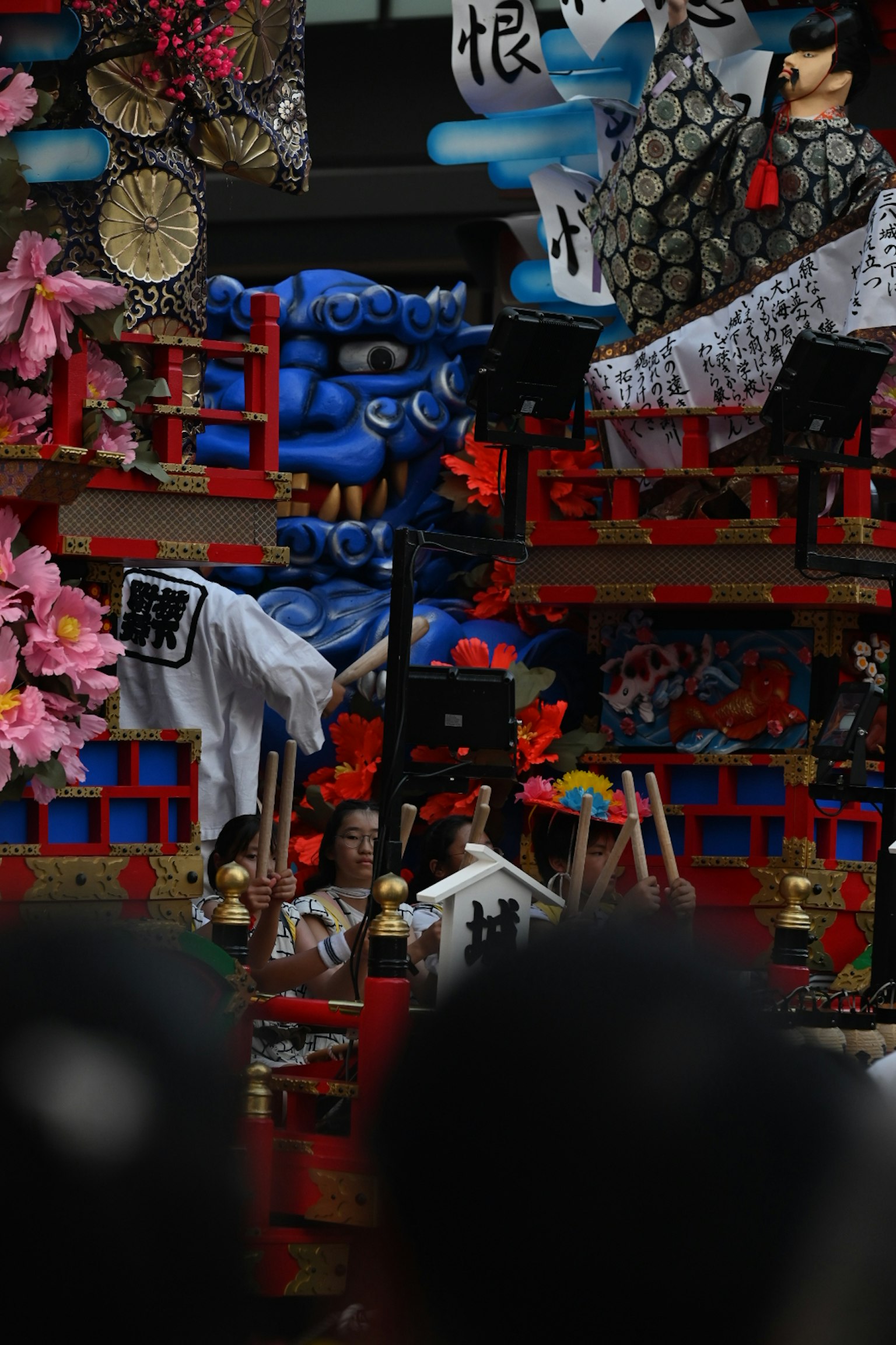 Colorful festival float decorated with various ornaments and traditional elements