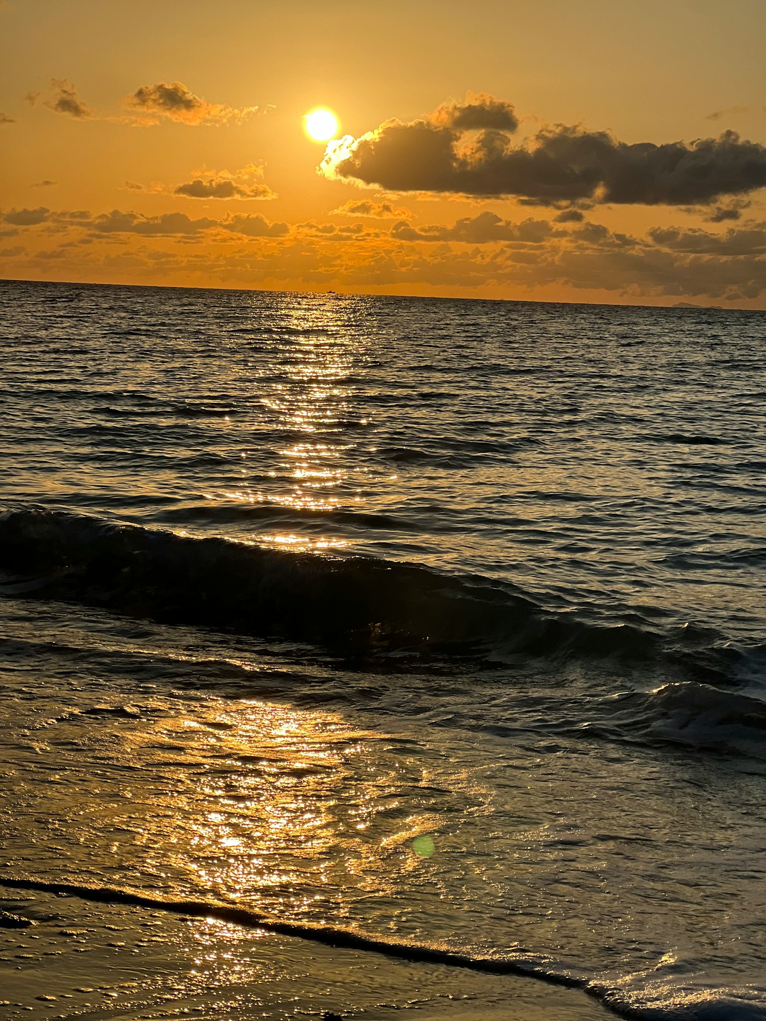Beautiful seascape with waves and a glowing sunset