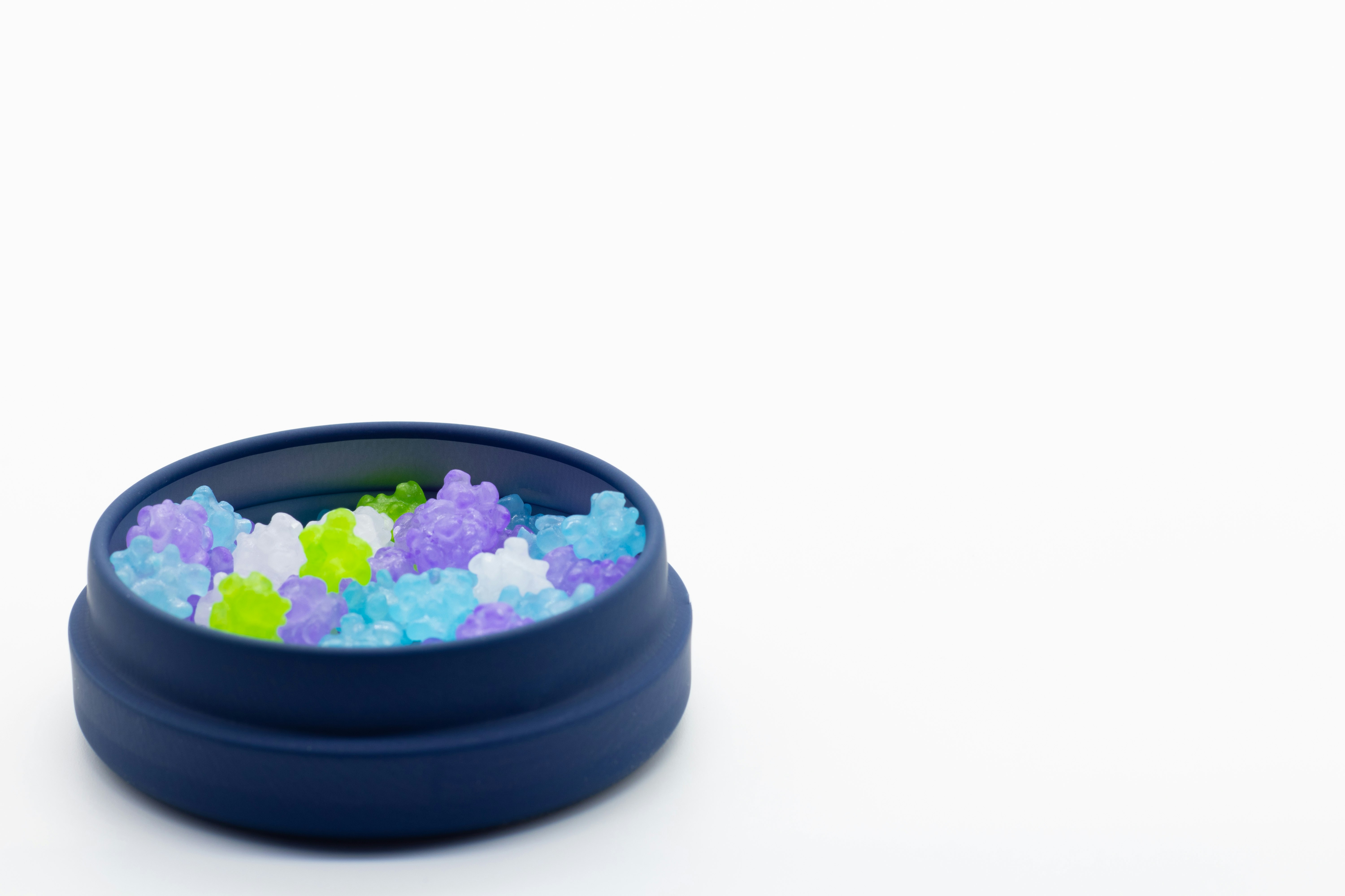 colorful slime-like beads in a blue bowl