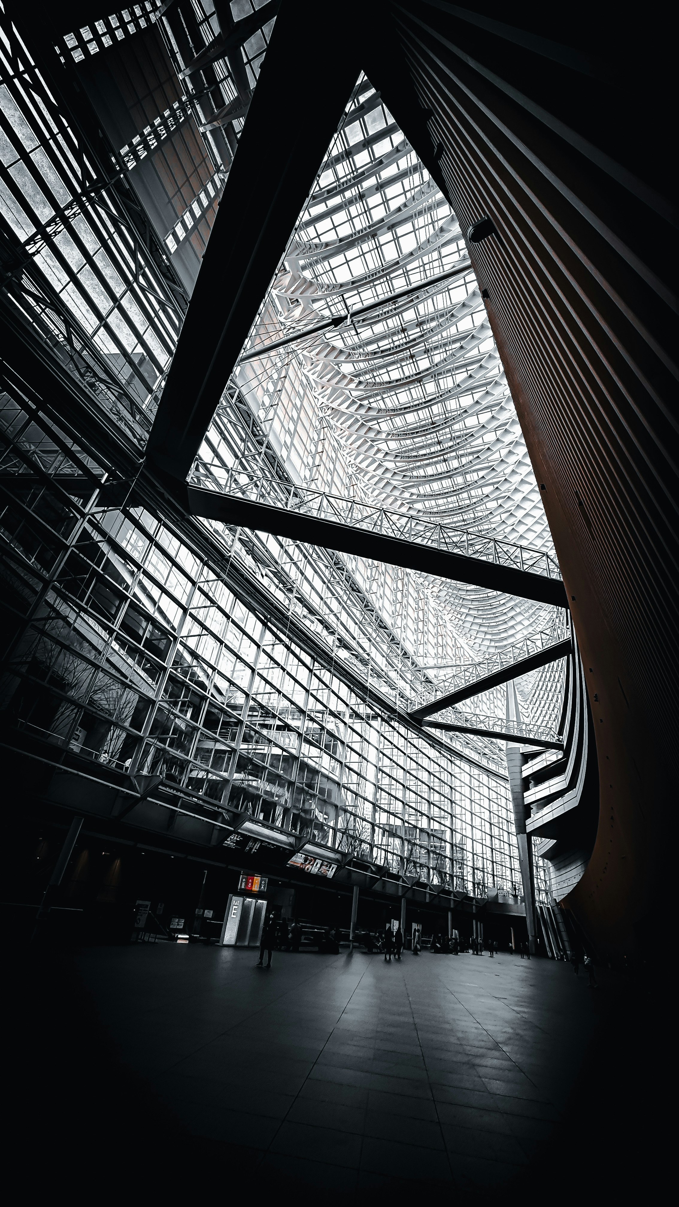 Light streaming into a glass-walled atrium art space