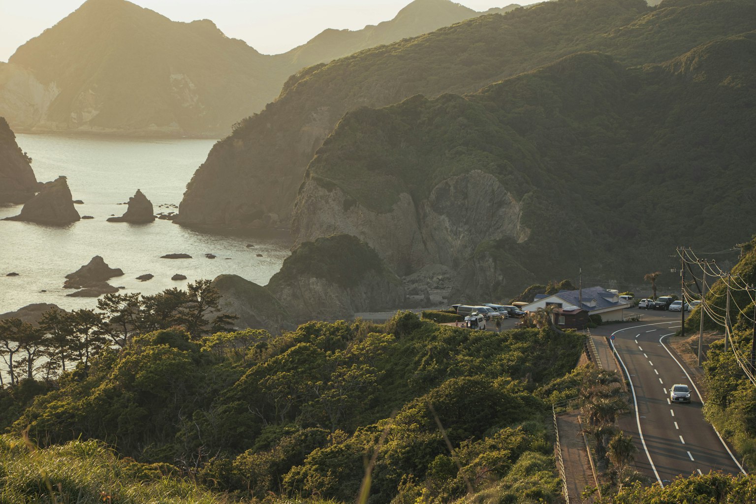 Coastal road with rocky shoreline and ocean view