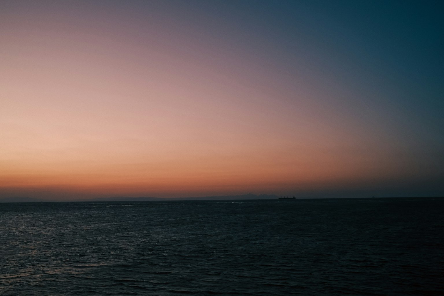 Serene ocean with beautiful sunset gradient