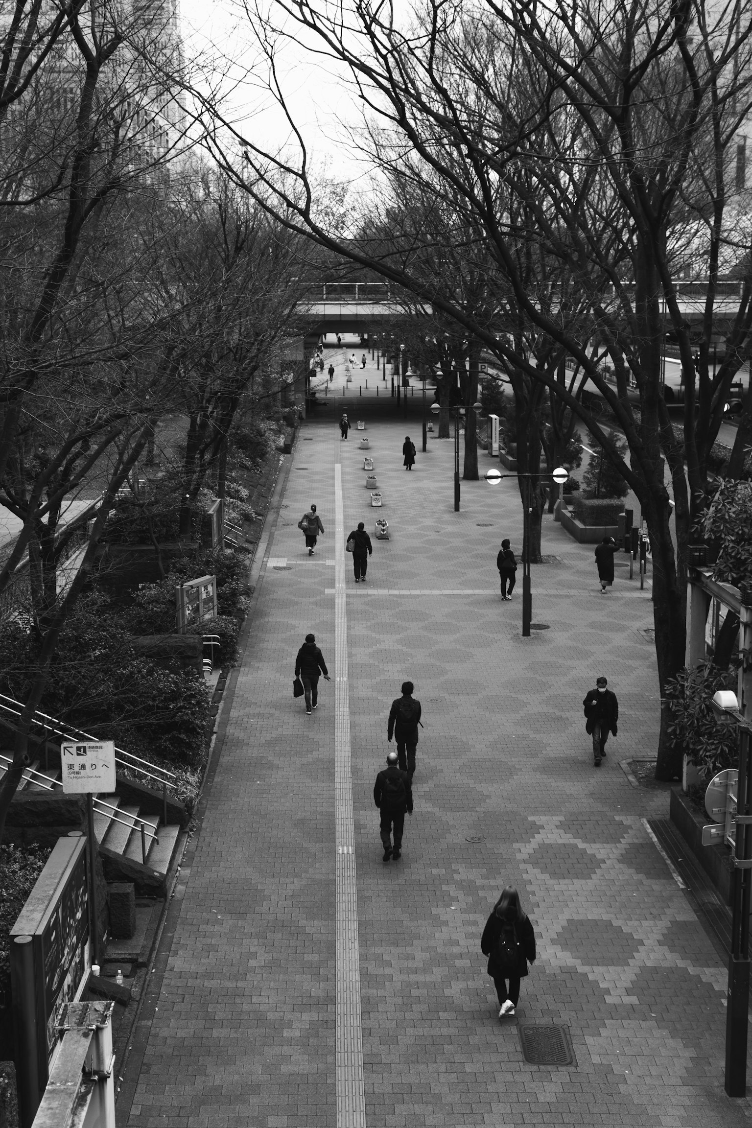 Black and white street scene with people walking