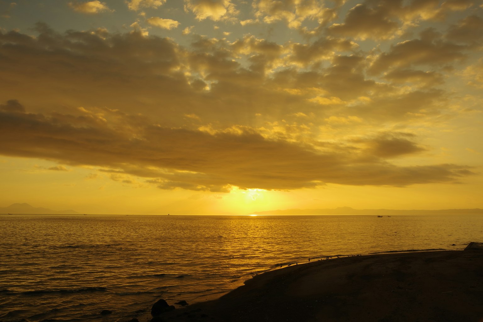 Beautiful sunset over the ocean with orange clouds