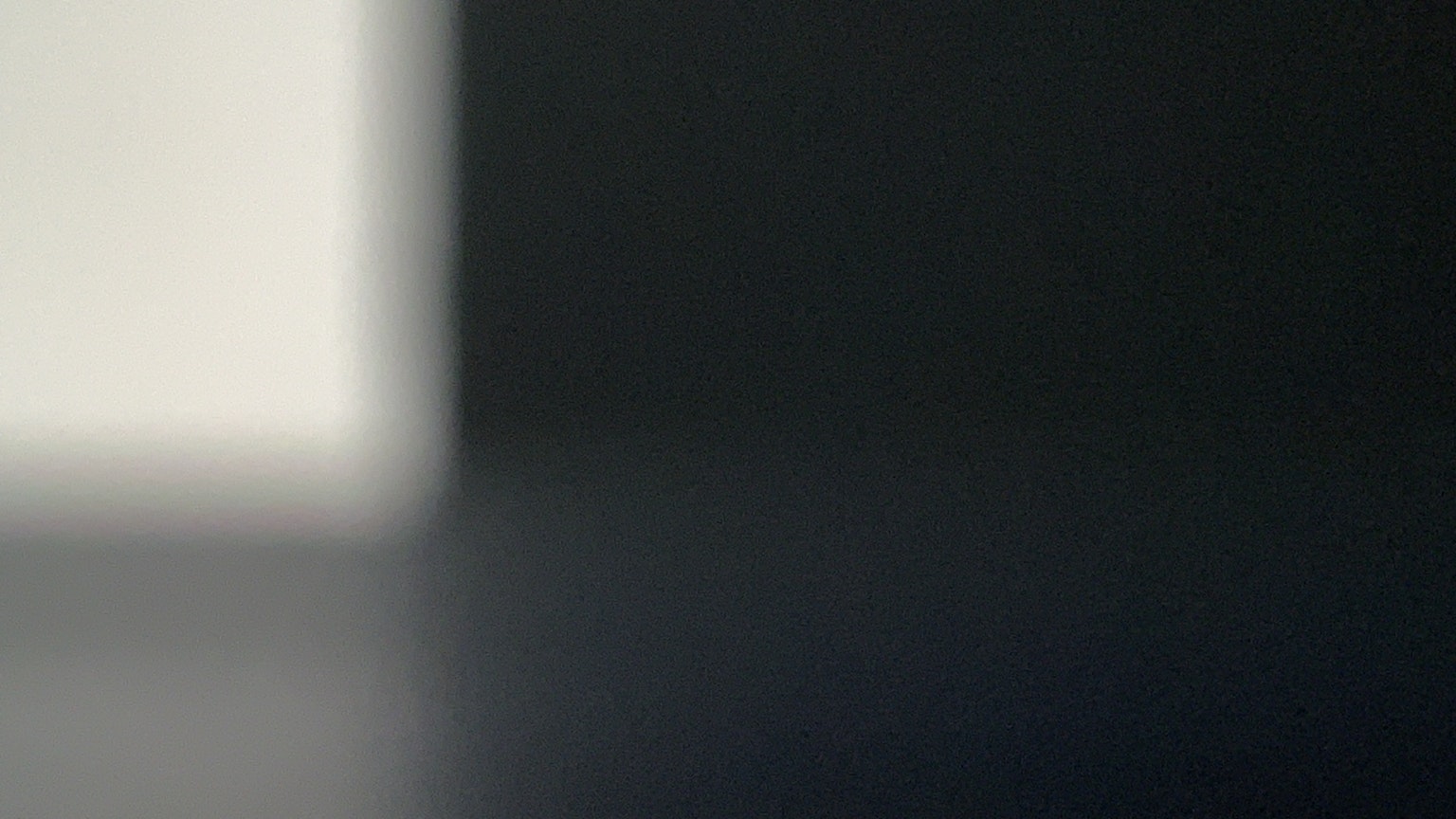 Blurred image with contrasting white and black sections