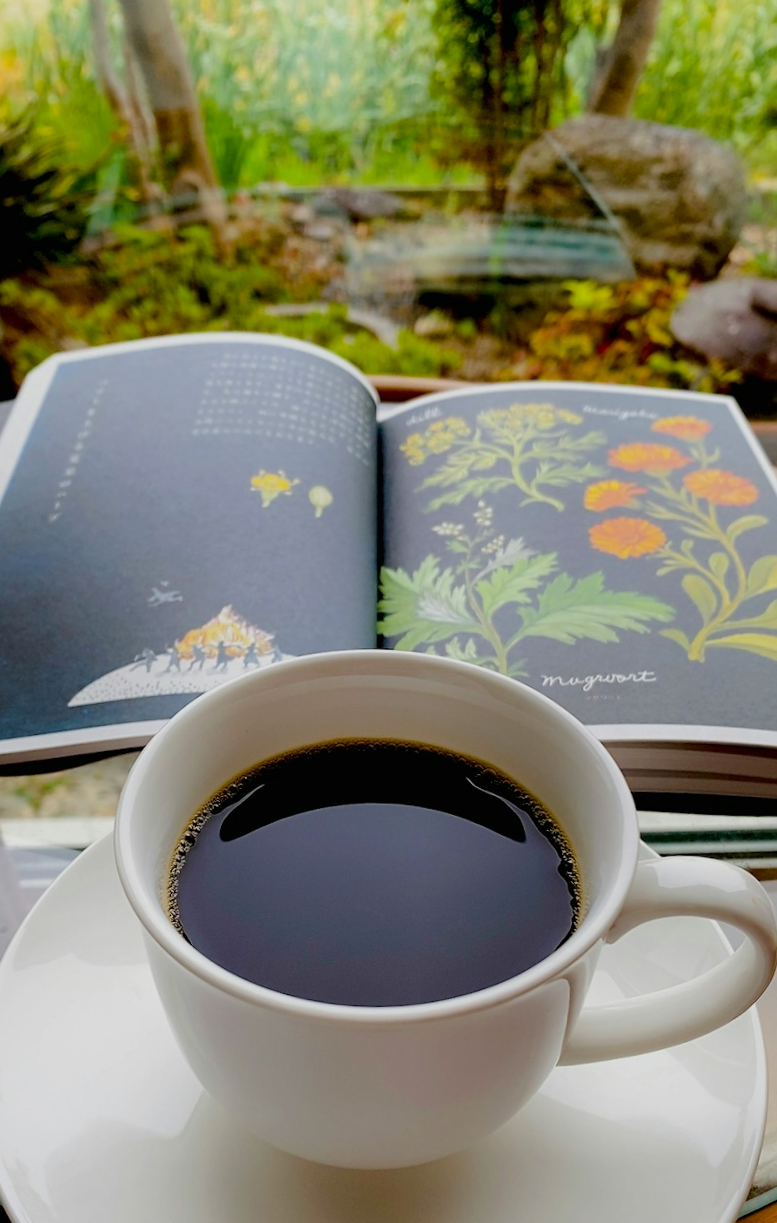 A serene scene with a cup of coffee and an open book surrounded by nature