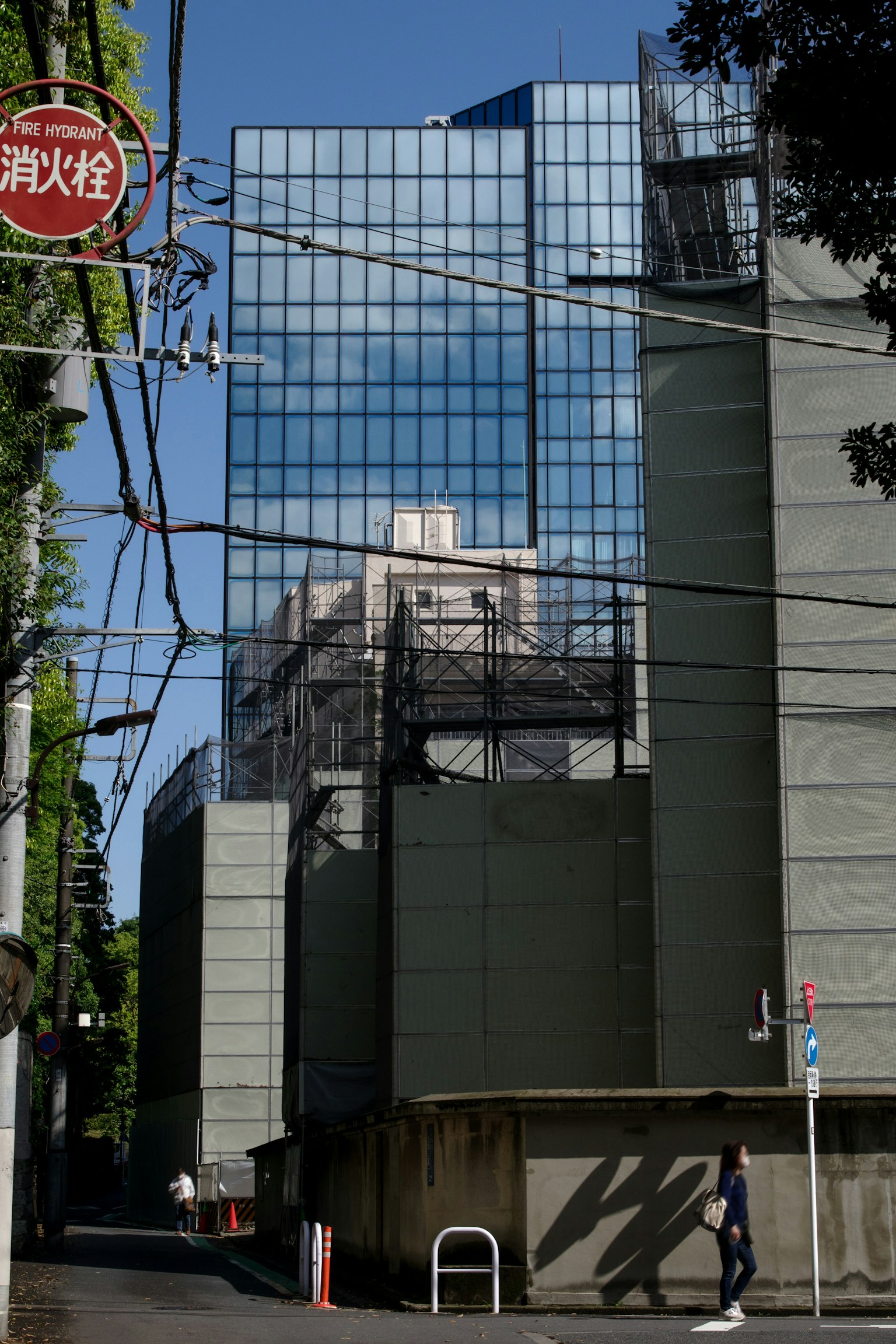Urban scene featuring a high-rise building and power lines