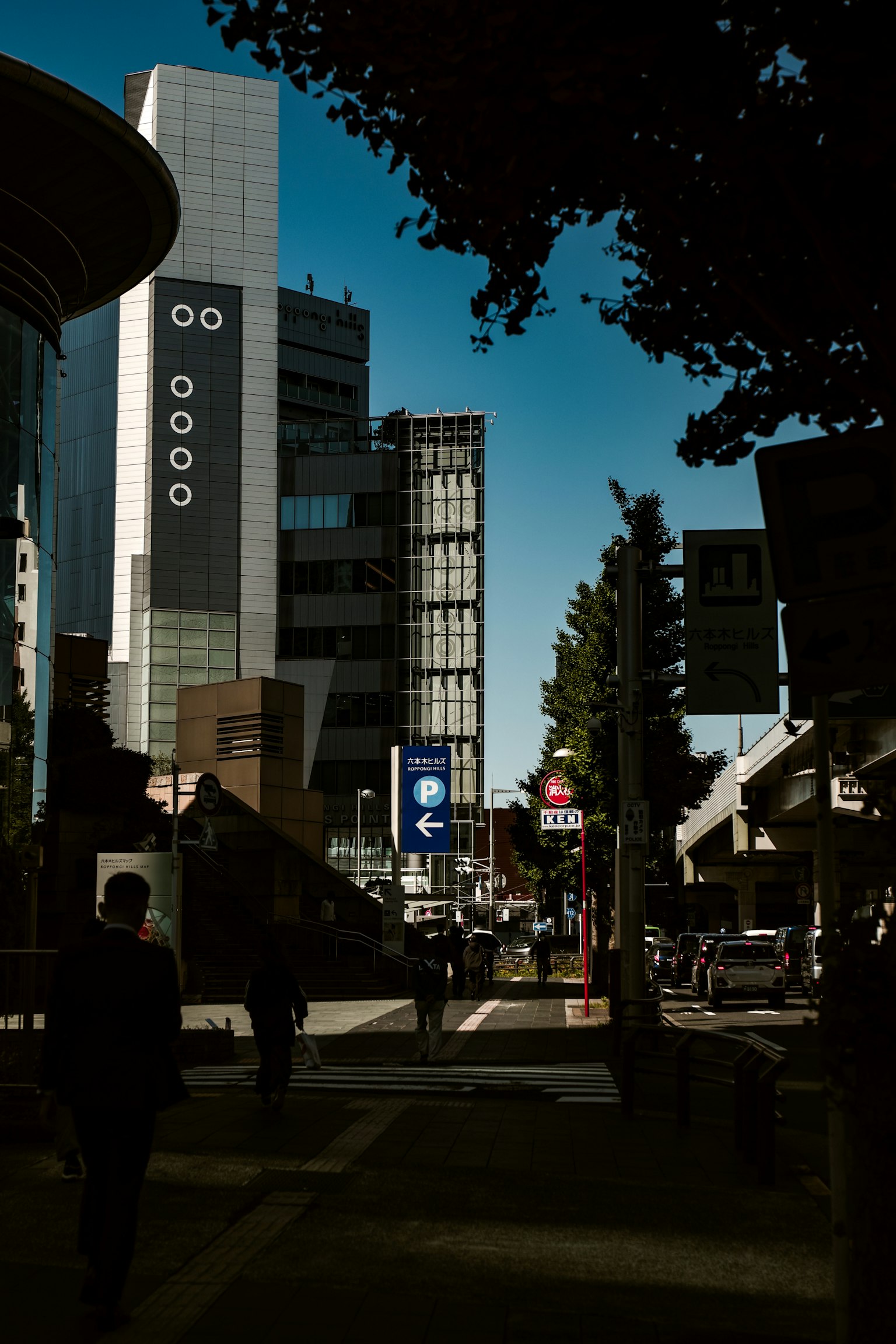 Modern buildings on a city street with a clear blue sky