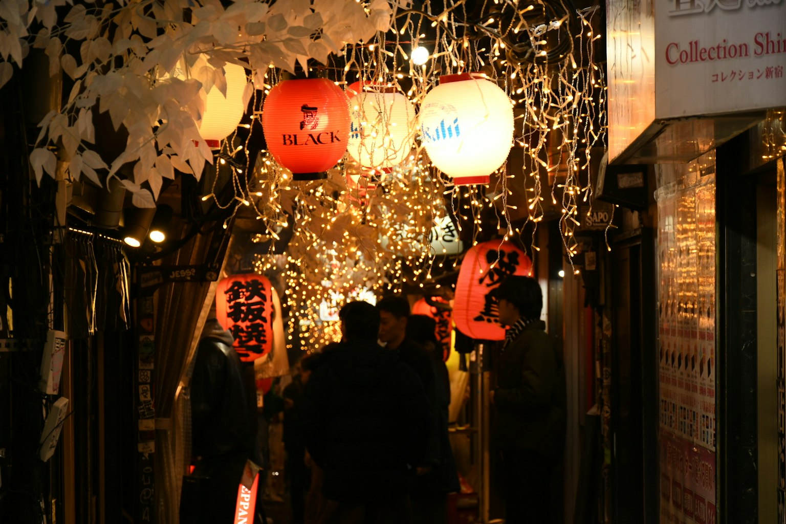 Night market scene with colorful lanterns and twinkling lights