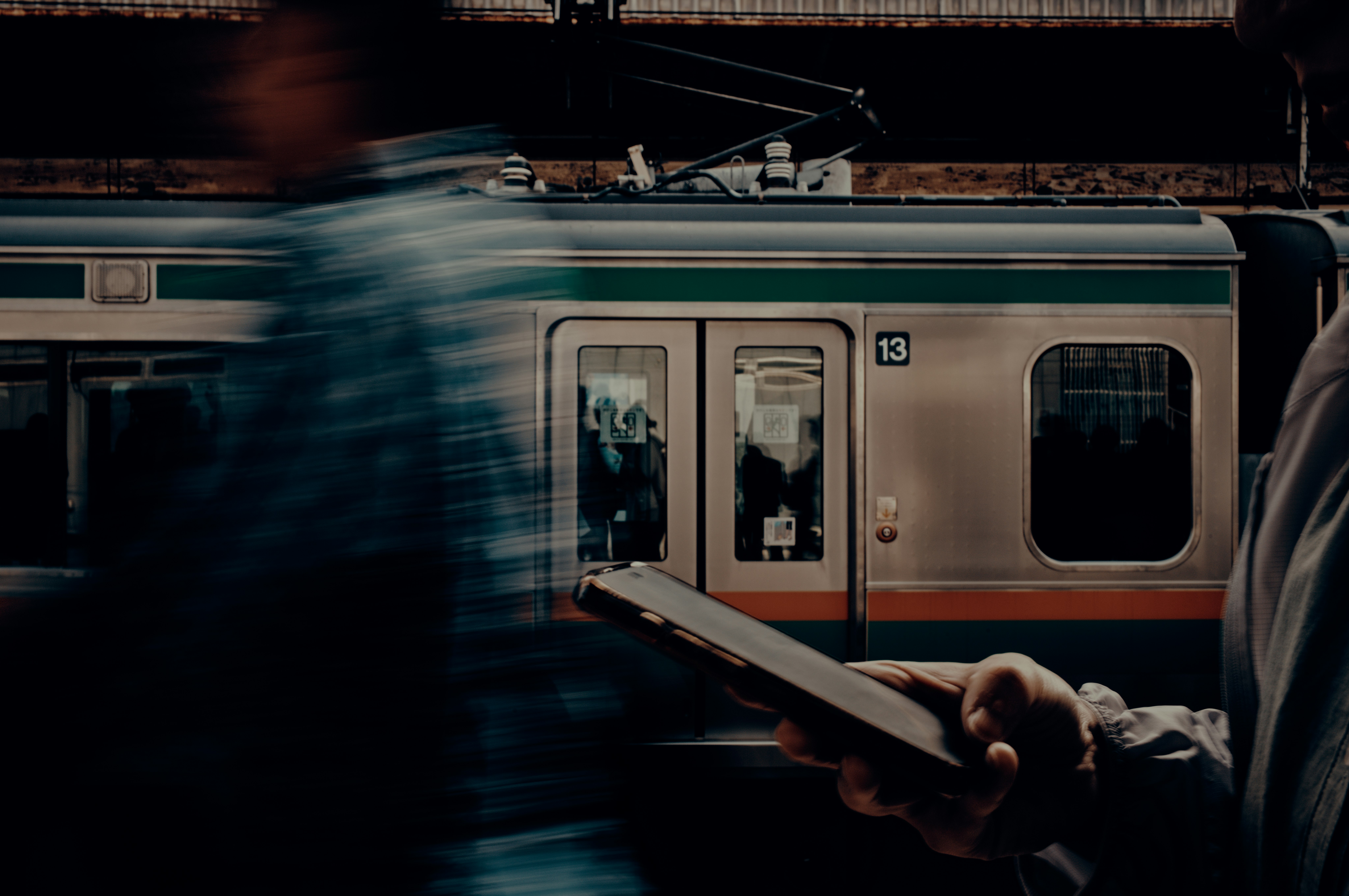 passing train window with platform silhouettes