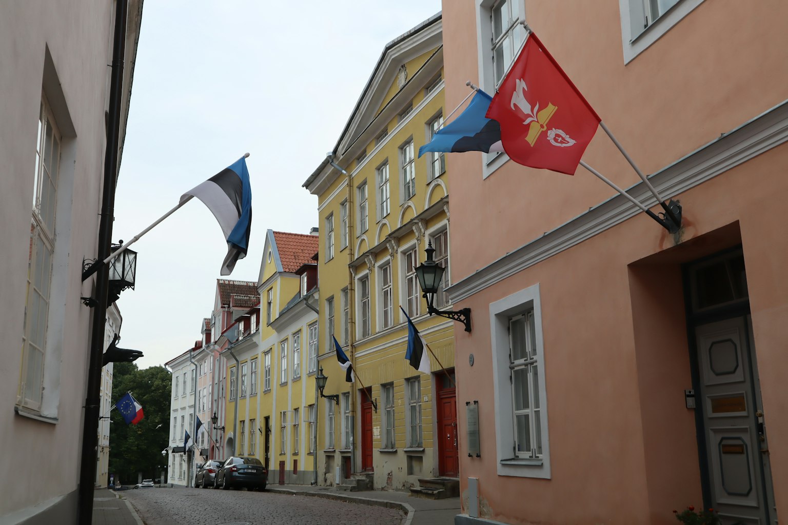 Colorful street with Estonian flags displayed on buildings