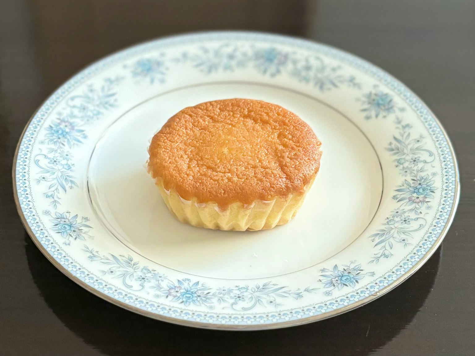 Cupcake on a white floral plate