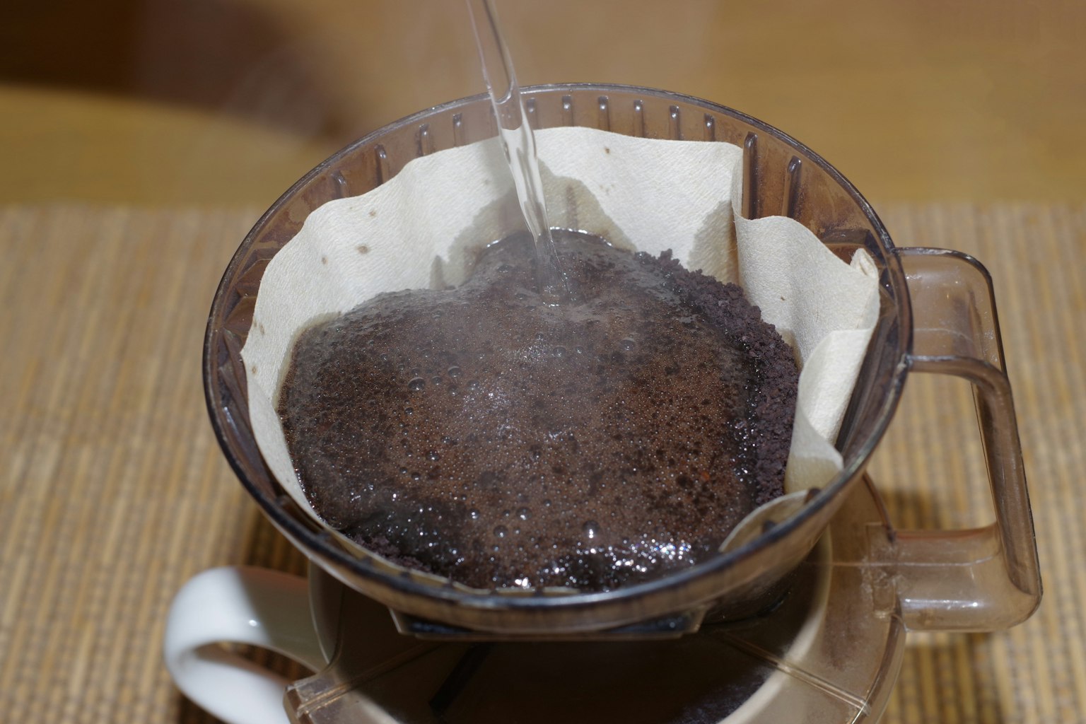 Image of coffee brewing with steam rising