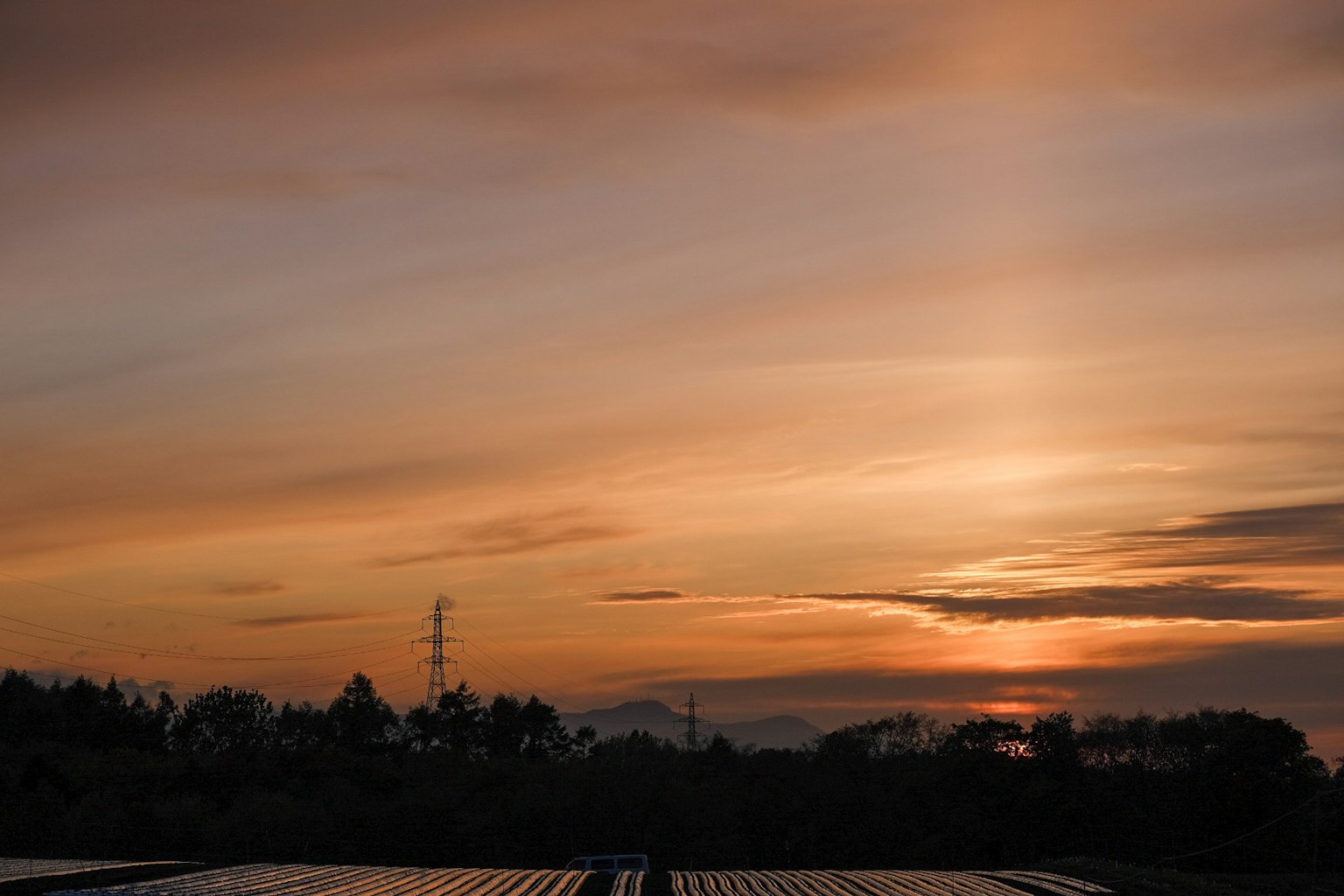 Landscape featuring a sunset sky with distant mountains