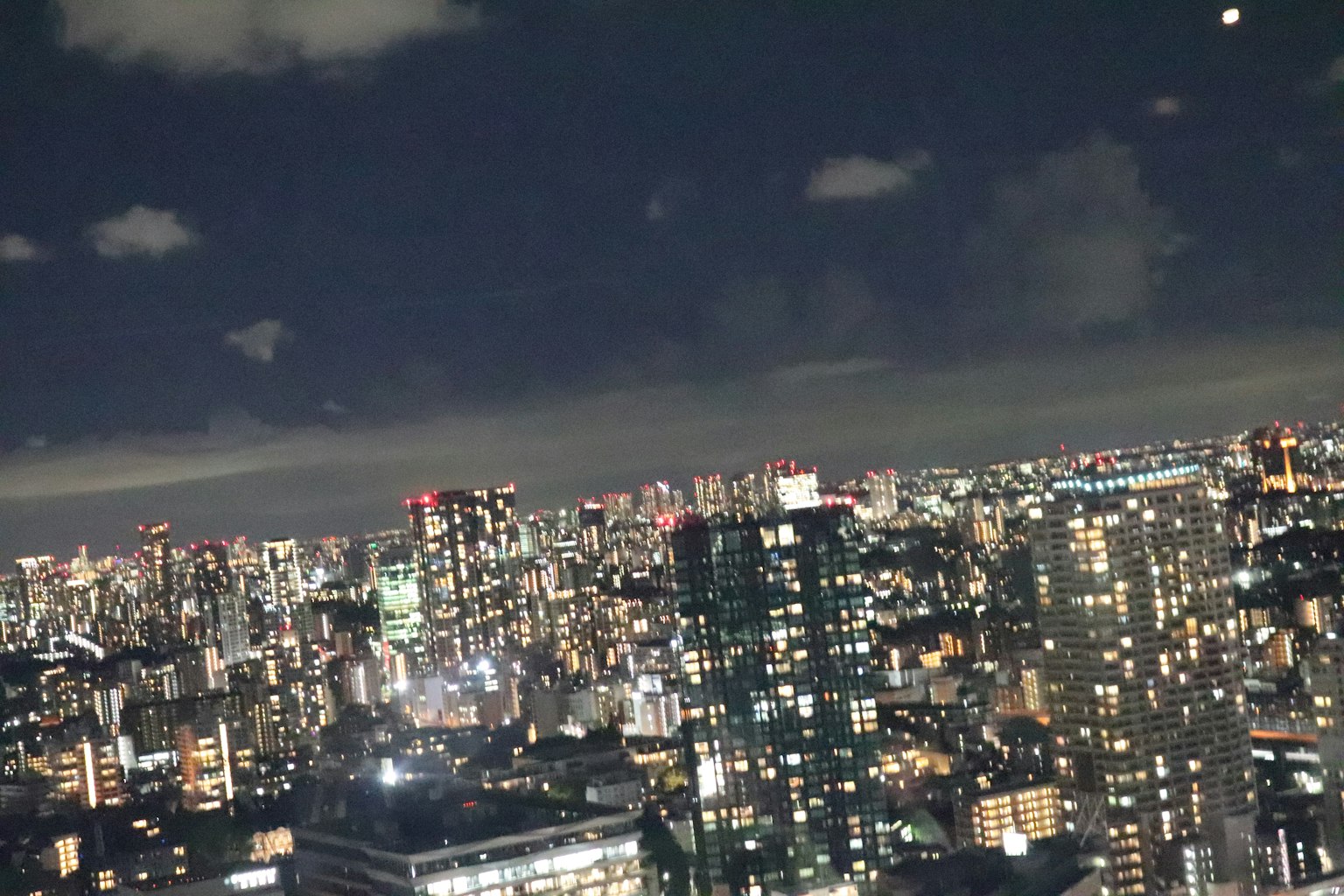 Night view of Tokyo skyline with illuminated skyscrapers