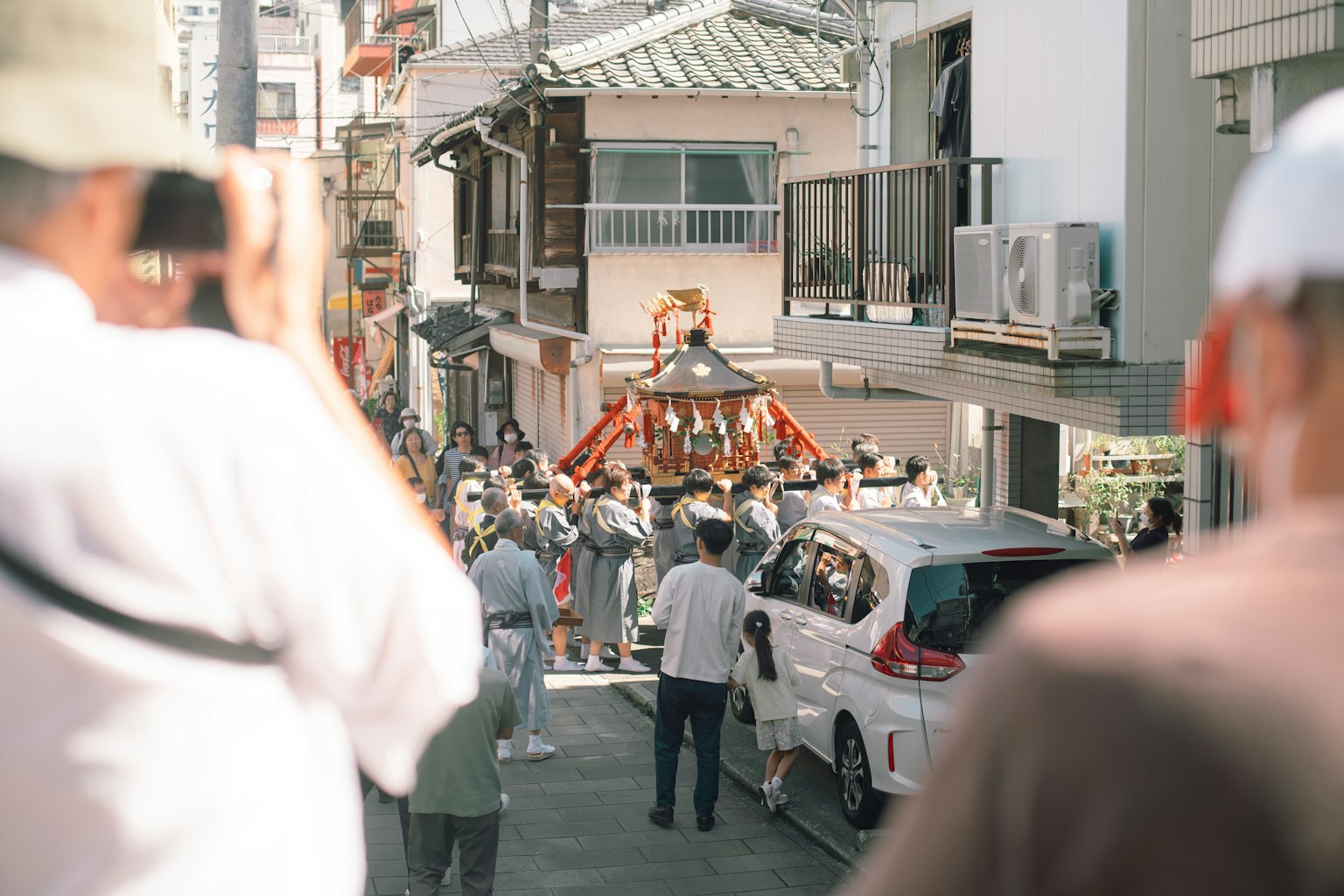 Street scene with a festival parade and people gathering