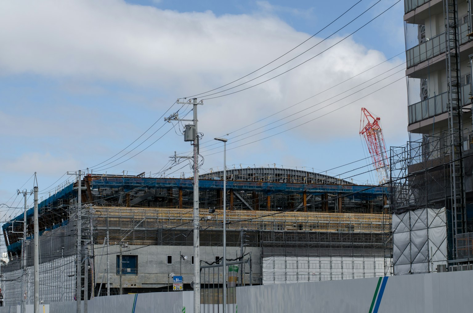 Construction site featuring a stadium and surrounding buildings